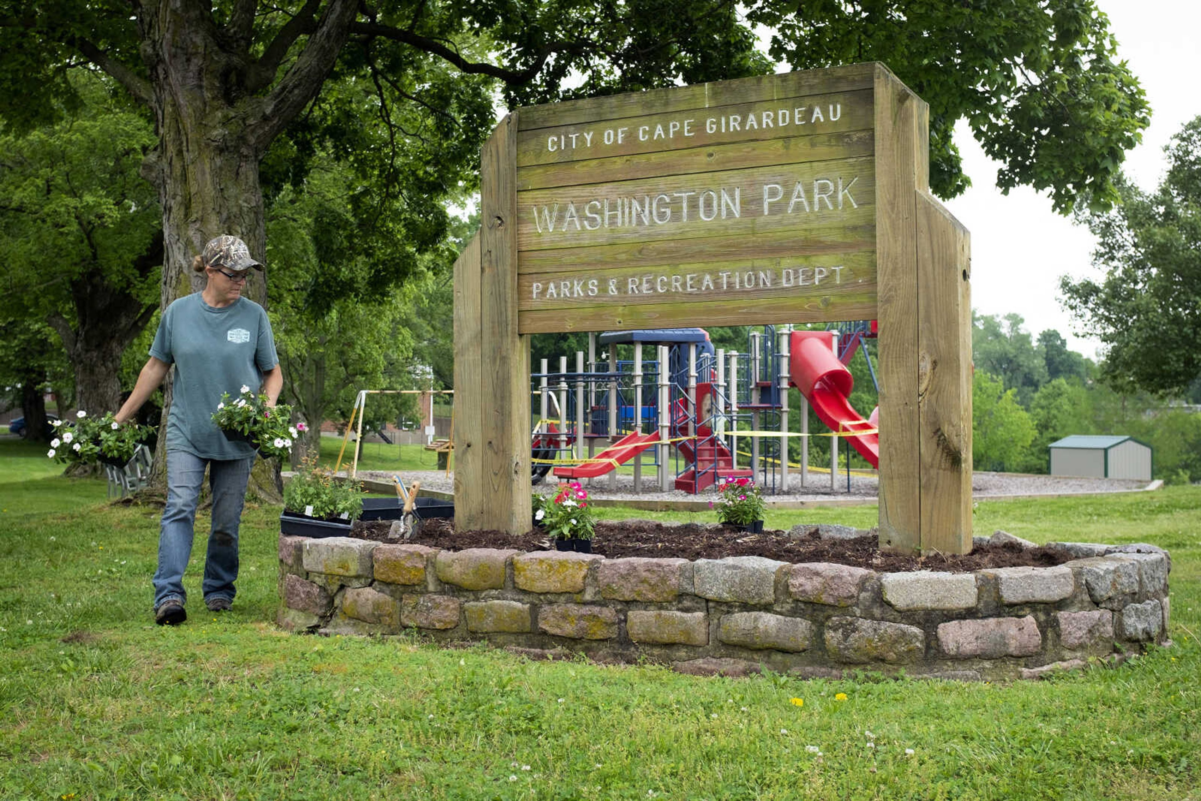 Melissa LaPlant, manager of Southeast Missouri State University's Charles Hutson Greenhouse, gardens Saturday, May 16, 2020, at Washington Park in Cape Girardeau.