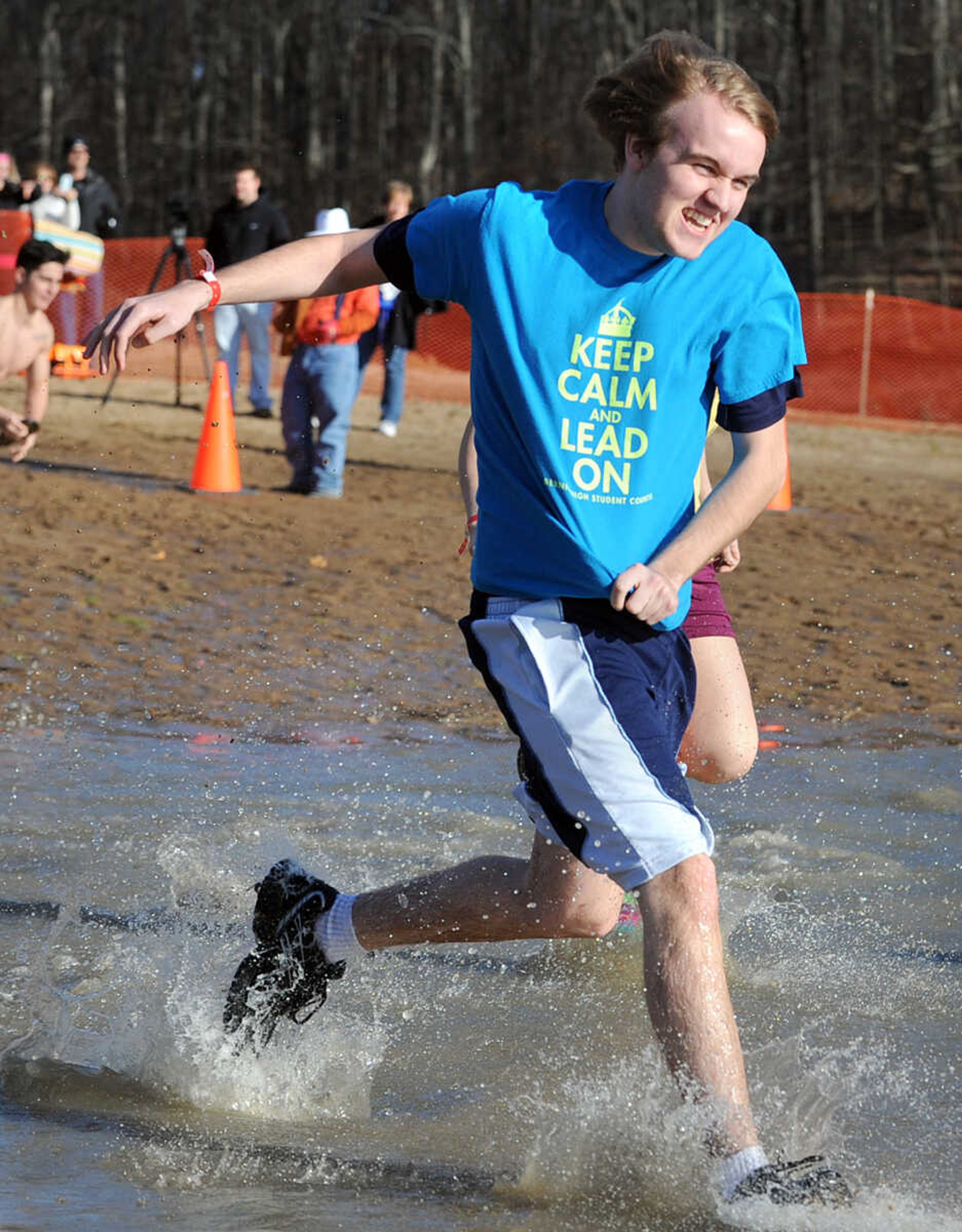 LAURA SIMON ~ lsimon@semissourian.com
People plunge into the cold waters of Lake Boutin Saturday afternoon, Feb. 2, 2013 during the Polar Plunge at Trail of Tears State Park. Thirty-six teams totaling 291 people took the annual plunge that benefits Special Olympics Missouri.