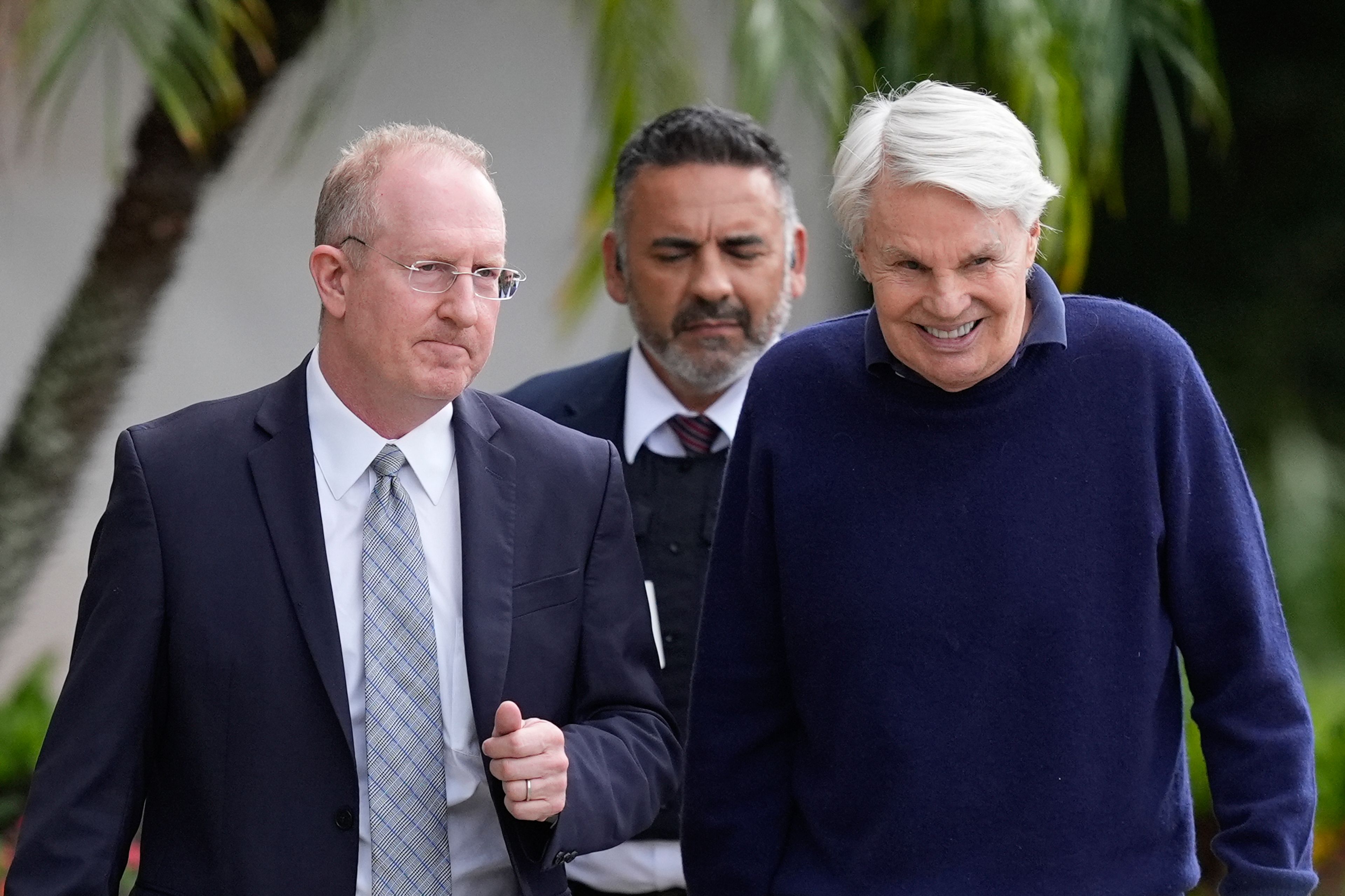 Michael Jeffries, right, former CEO of Abercrombie & Fitch, leaves with his attorney Brian Bieber, left, following a hearing at the Paul G. Rogers Federal Building and U.S. Courthouse, in West Palm Beach, Fla., Tuesday, Oct. 22, 2024. (AP Photo/Rebecca Blackwell)