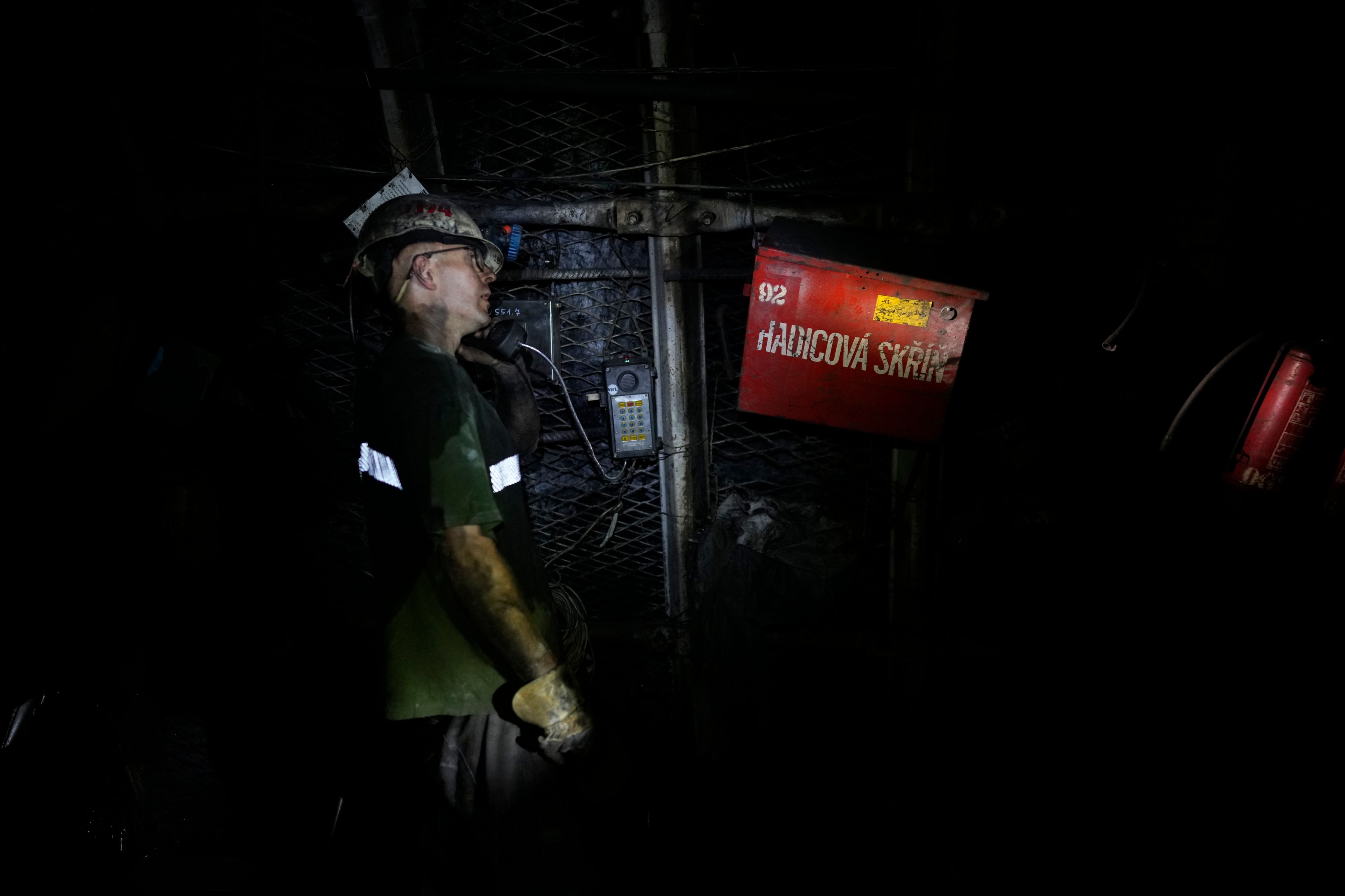 A miner talks on the phone in a shaft of the CSM coal mine in Stonava, Czech Republic, Monday, Oct. 14, 2024. (AP Photo/Petr David Josek)