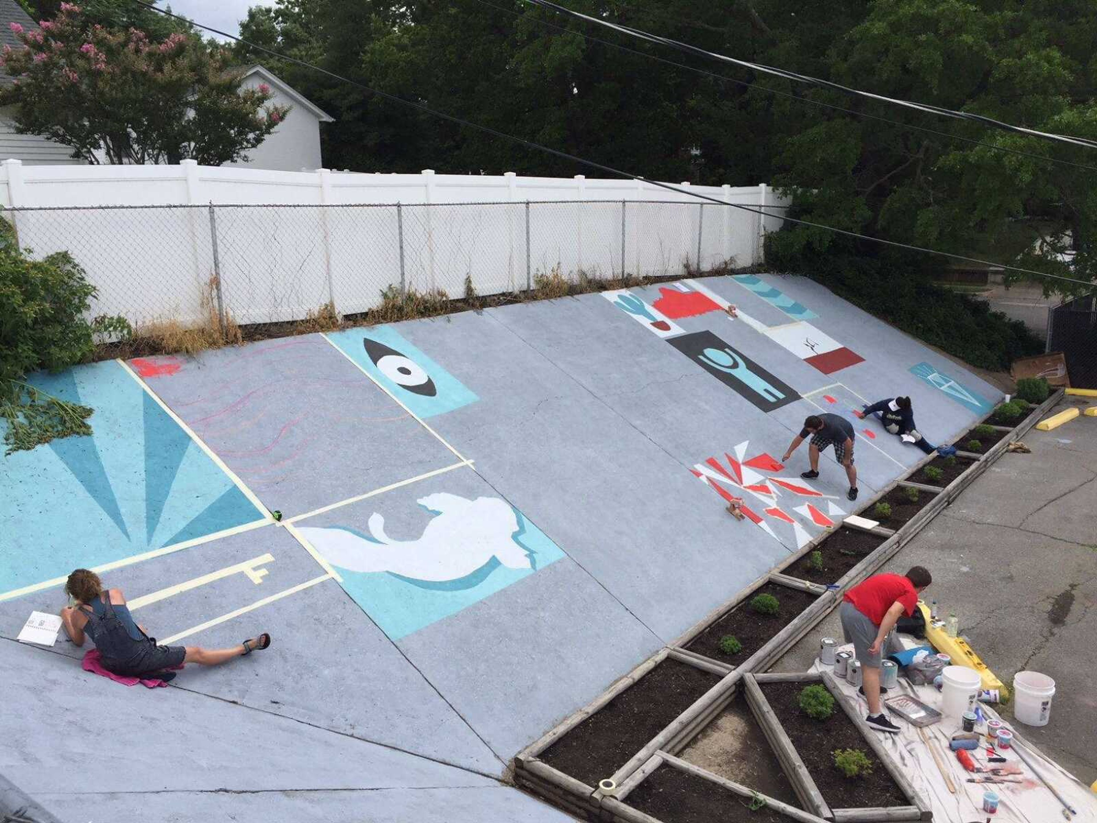 Southeast Missouri State University art students complete a mural at Stevie's Steakburger in Cape Girardeau.