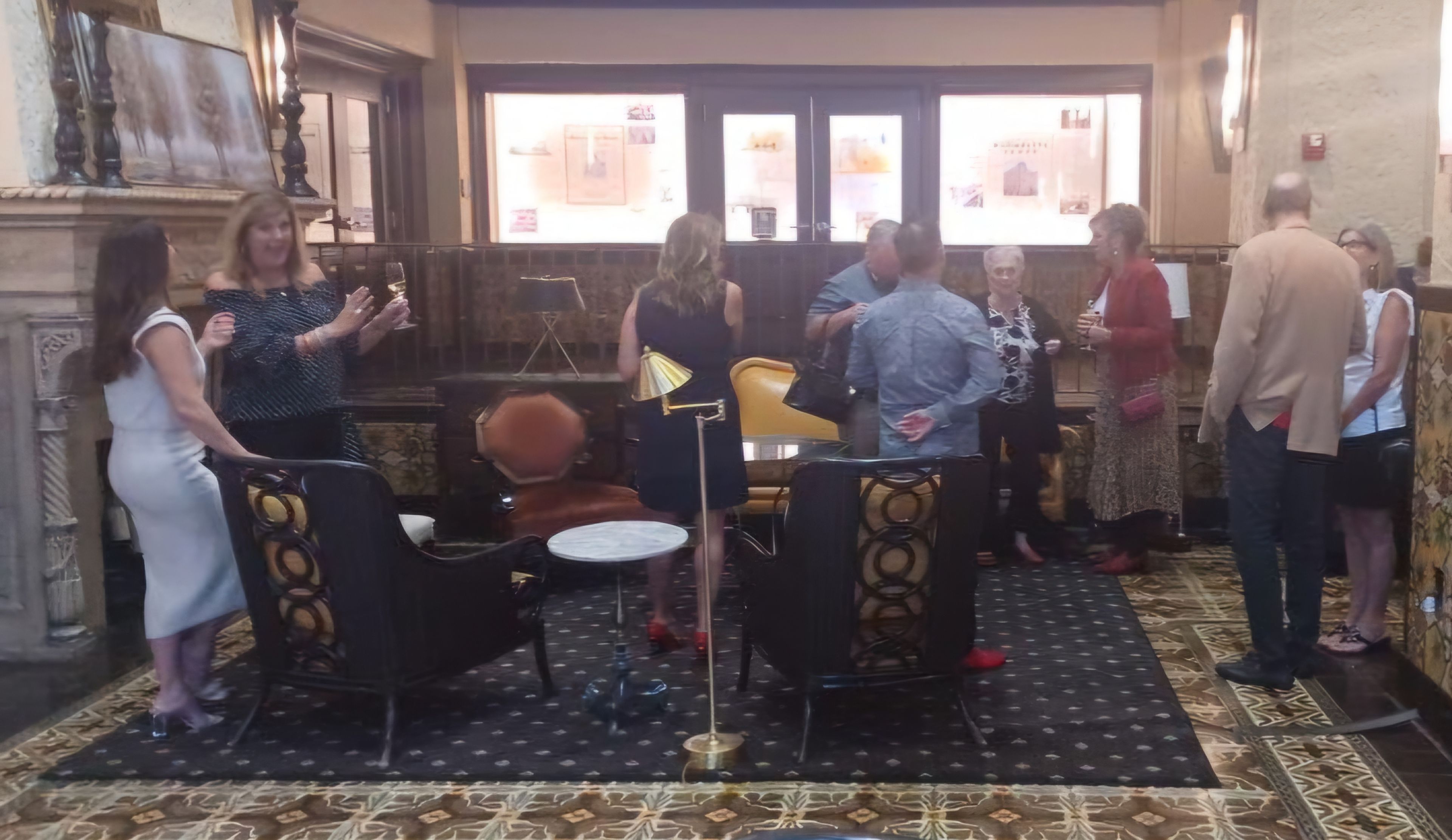 Guests mingling in the lobby before dinner.