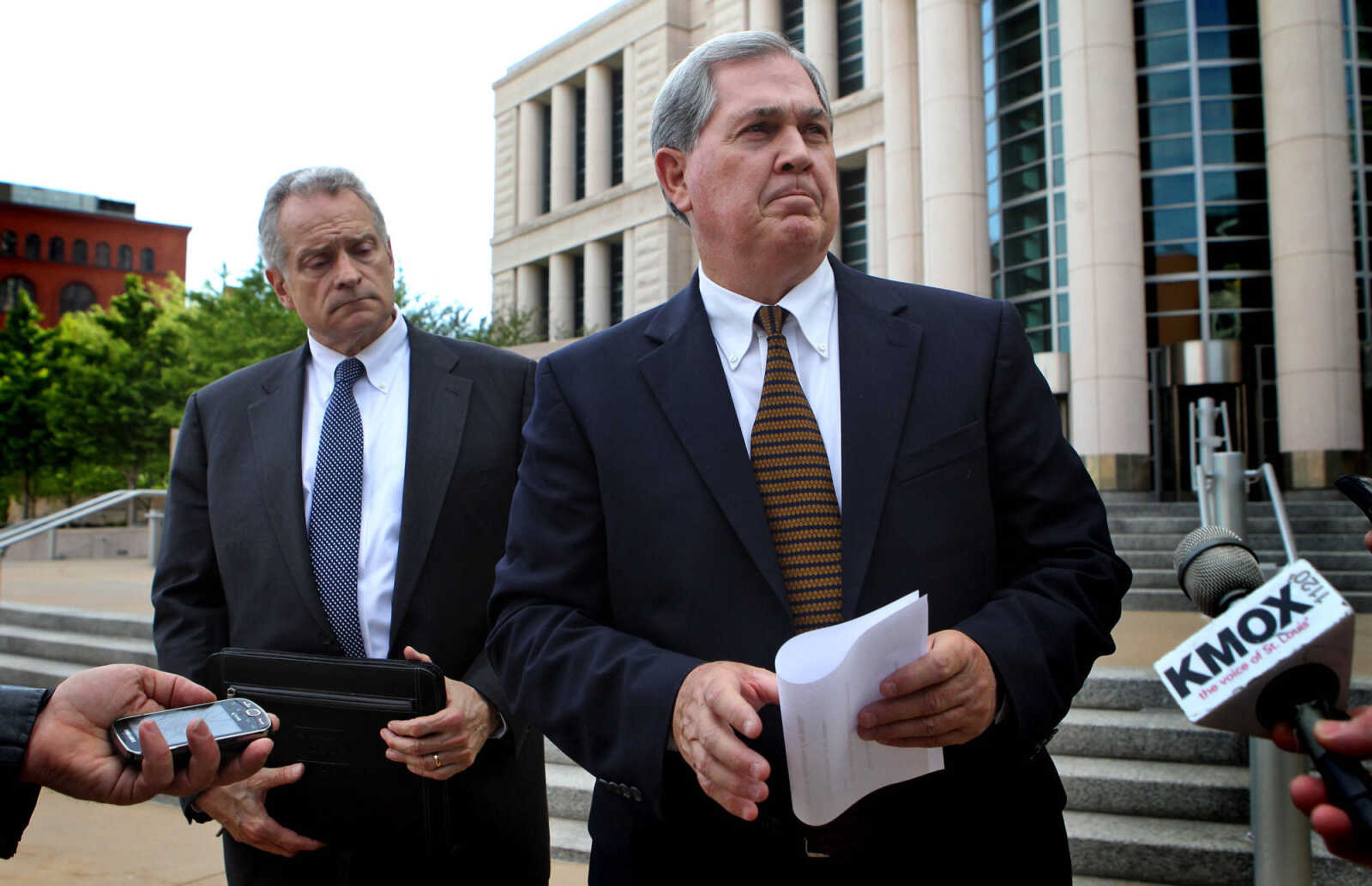 Former Missouri Gov. Roger Wilson (right) reads a statement acknowledging his mistake in front of the Eagleton Courthouse after he pleaded guilty this afternoon in connection with indictments for allegedly laundering campaign contributions to the Missouri Democratic Party through a St. Louis law firm Thursday, April 12, 2012. To the left his is attorney Robert Haar. (AP Photo/St. Louis Post-Dispatch, Laurie Skrivan)