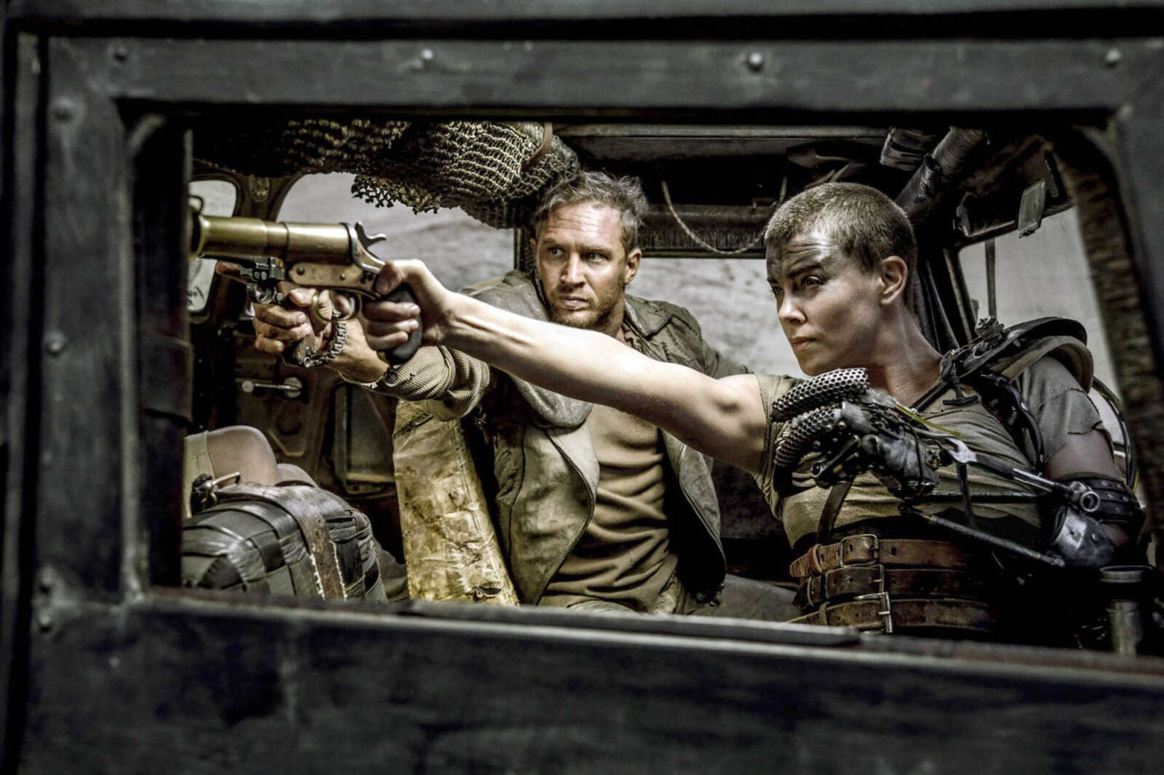 This photo shows Tom Hardy, center, as Max Rockatansky and Charlize Theron, right, as Imperator Furiosa in "Mad Max: Fury Road," which received 10 Oscar nominations. (Jasin Boland ~ Warner Bros. Pictures via AP)