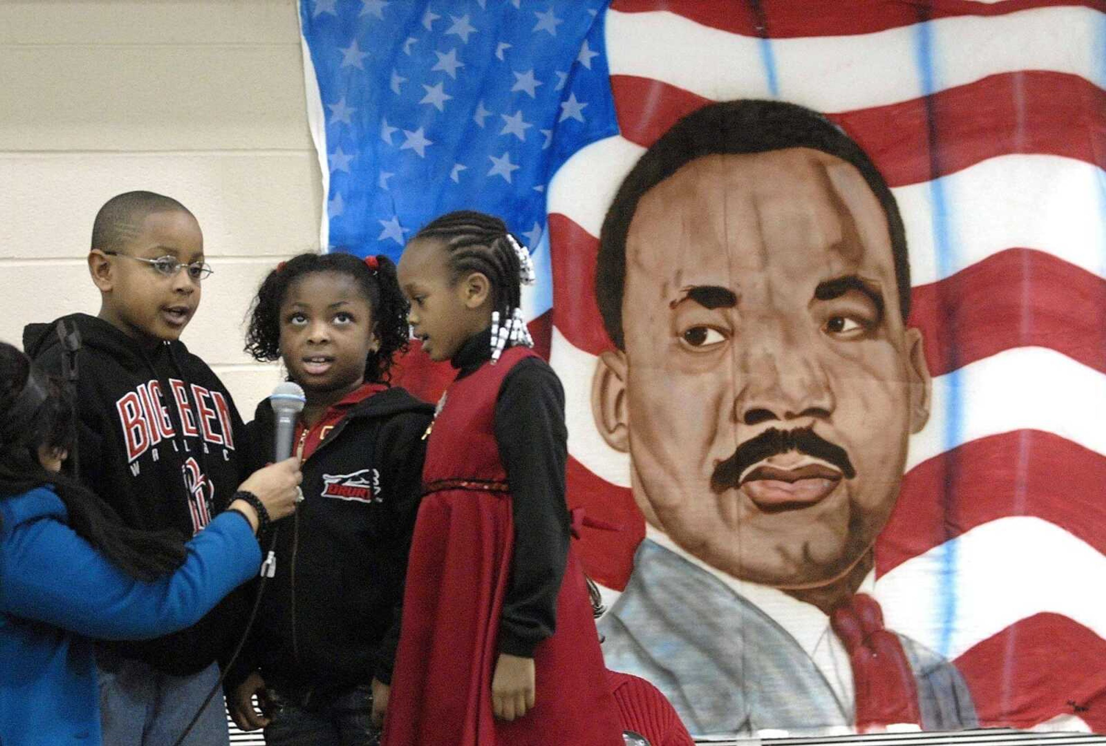 FRED LYNCH ~ flynch@semissourian.com<br>Charles Mosley III, Shekiynha Smith and Peighton Robinson sing "Mary Had a Baby" during the Dr. Martin Luther King Jr. Birthday Extravaganza Thursday at the Osage Community Centre. A video of the performance by Shere Khan from Central Middle School is available at semissourian.com.