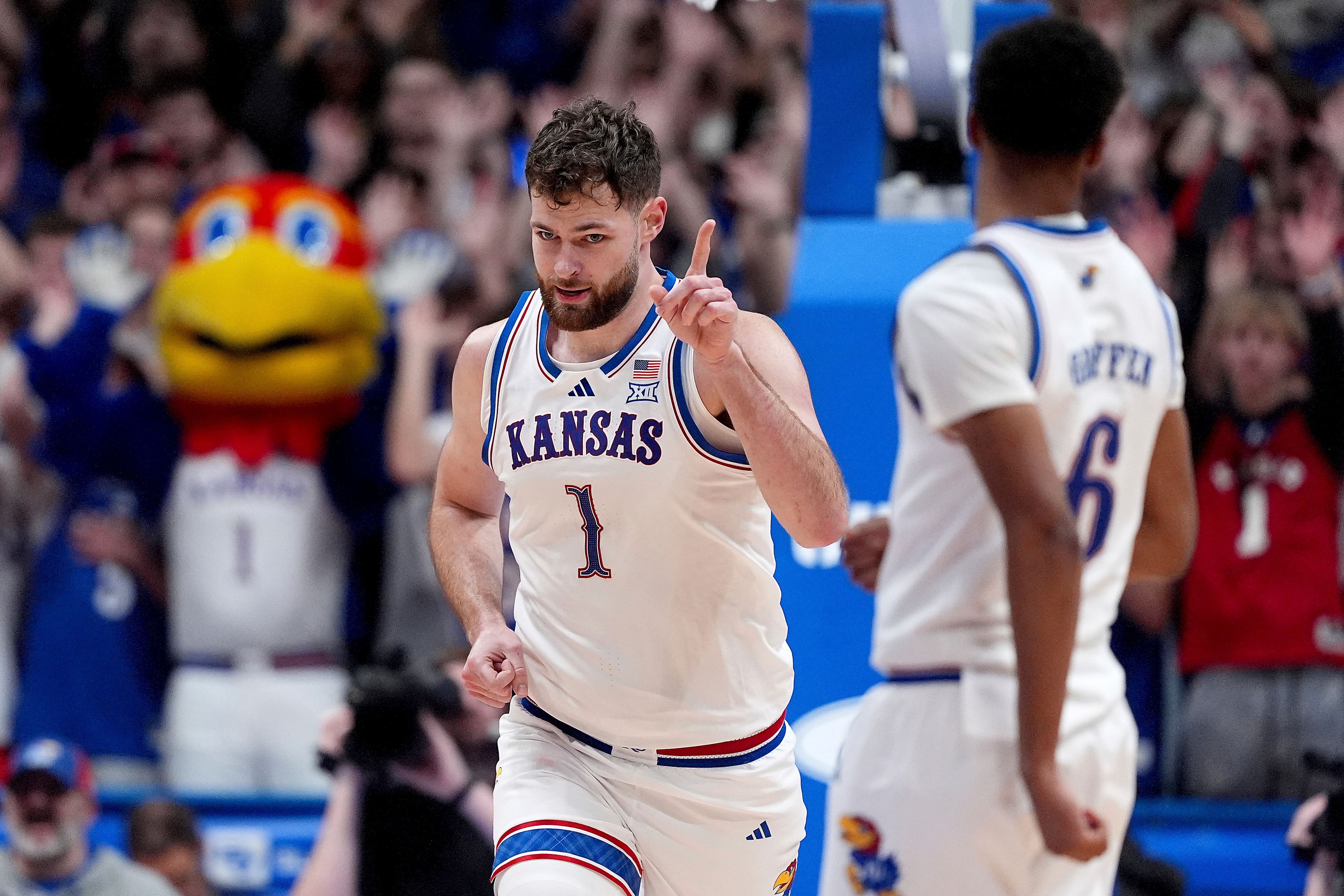 Kansas center Hunter Dickinson (1) celebrates after dunking the ball during the second half of an NCAA college basketball game against UNC Wilmington, Tuesday, Nov. 19, 2024, in Lawrence, Kan. (AP Photo/Charlie Riedel)