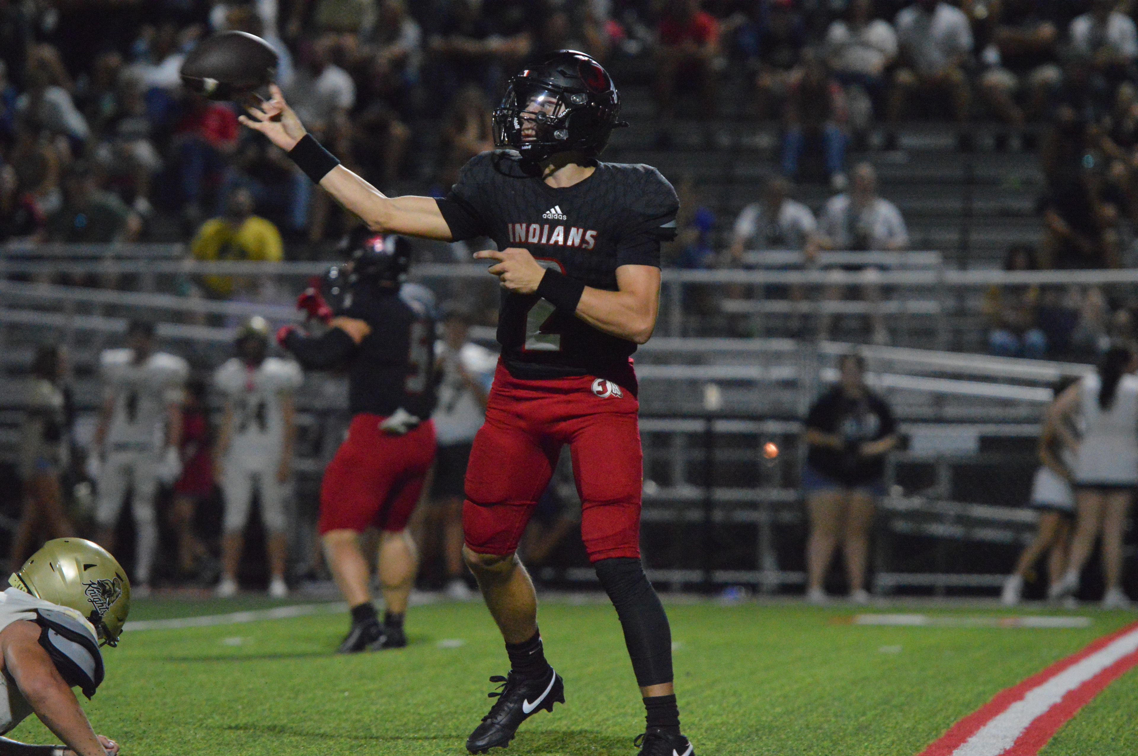 Jackson quarterback Drew Parsons slings a pass to his wide receiver against Farmington on Friday, Sept. 20. The junior signal caller finished with four total touchdowns in the game, including two through the air.