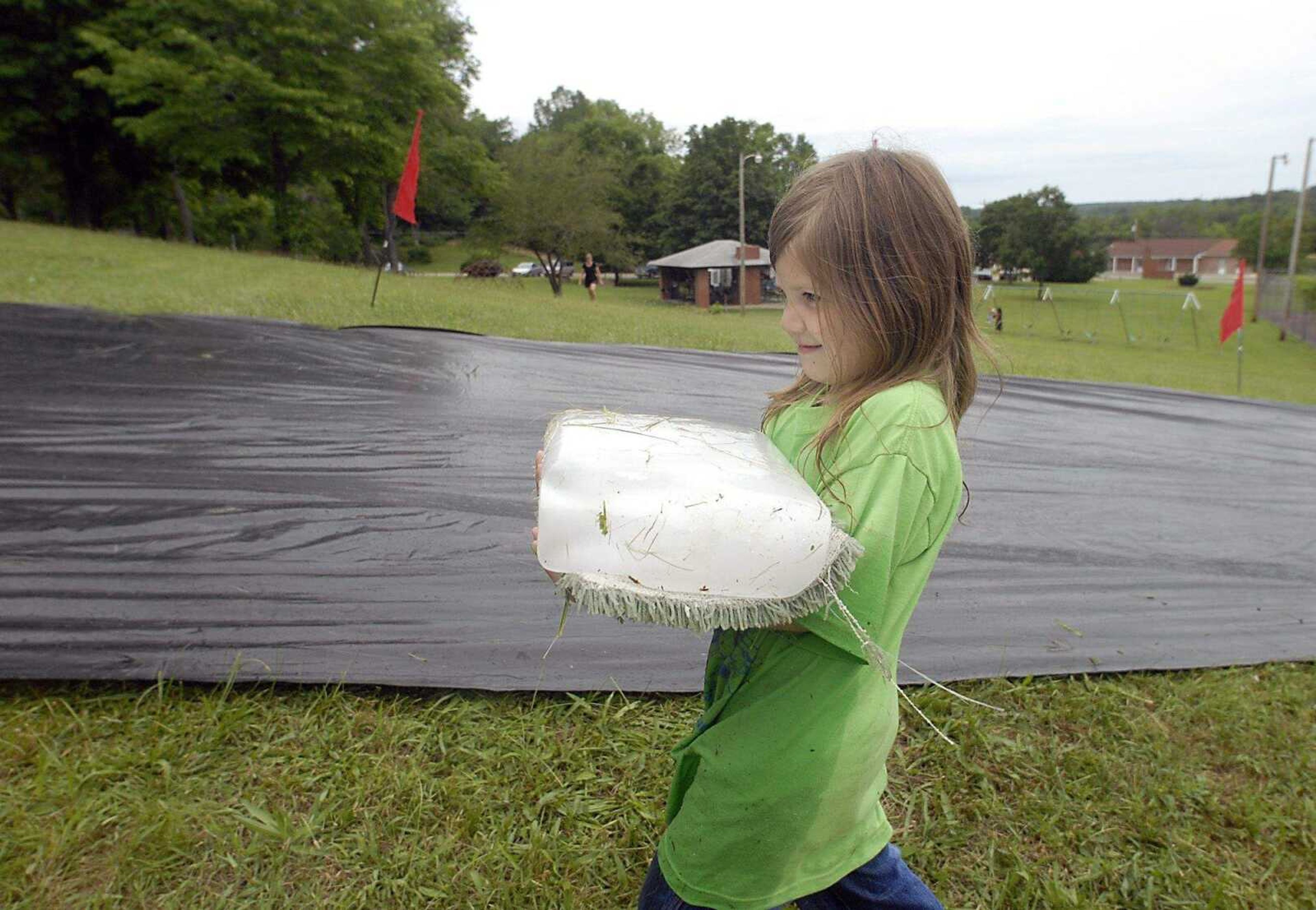 KIT DOYLE ~ kdoyle@semissourian.com
Courtney Holmes, 6, making her way back up the hill Satuday, June 28, 2008, while ice blocking at Pellegrino Park in Marble Hill.