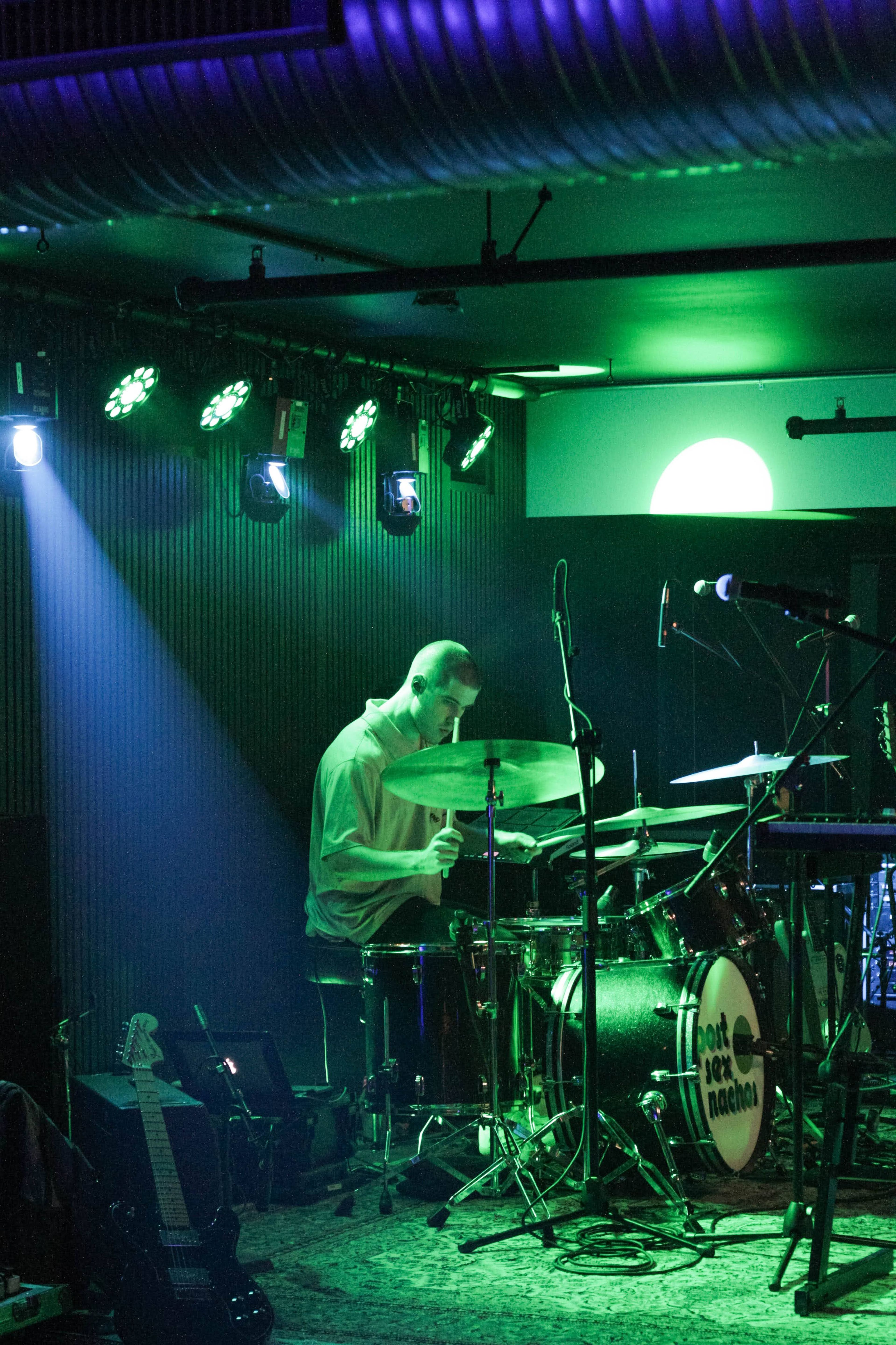 Parker Moore on the drums for opening band Tedious & Brief.