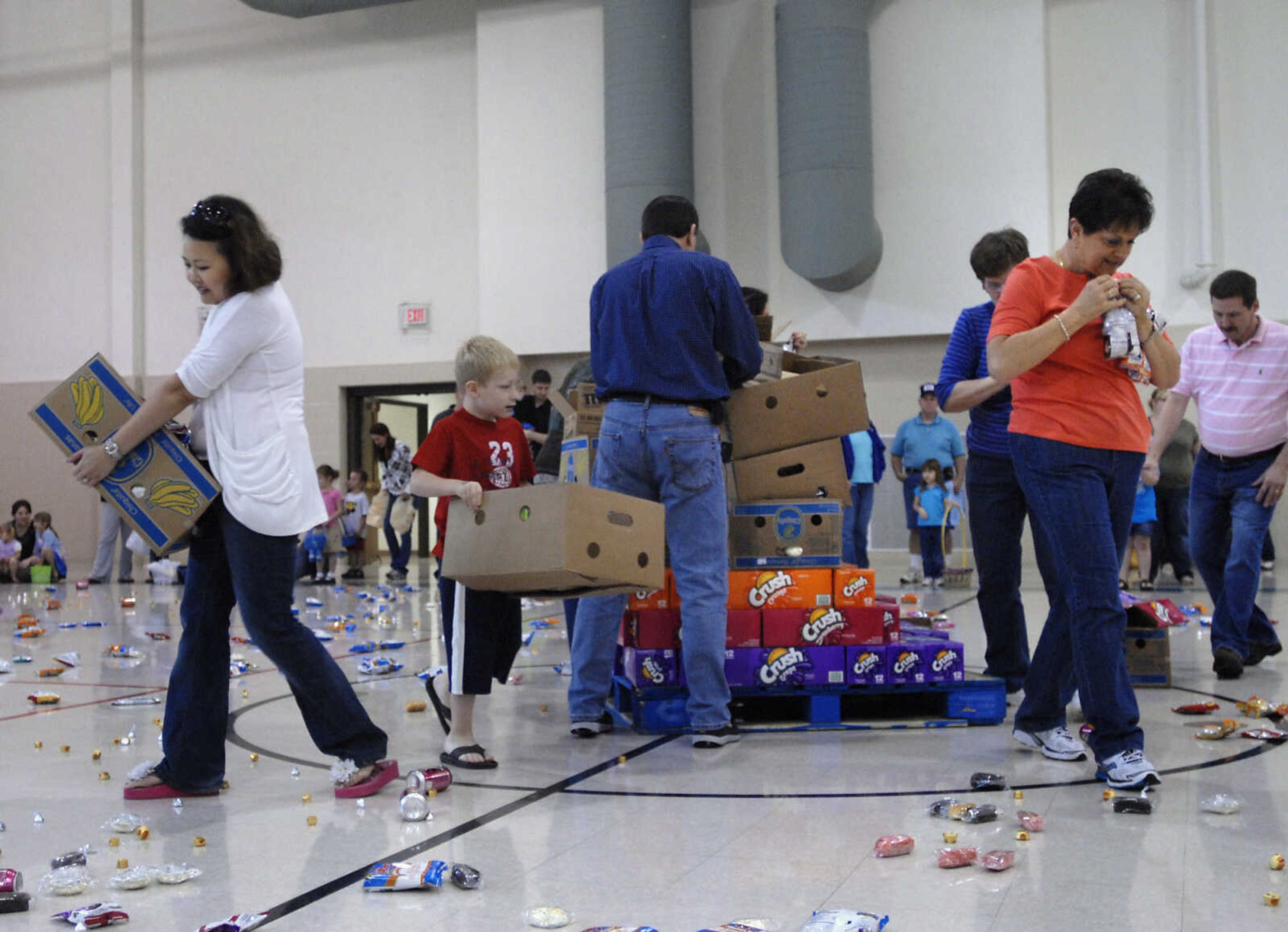 KRISTIN EBERTS ~ keberts@semissourian.com

Volunteers disperse goodies before the start of the next round during the Schnucks Pepsi Easter egg hunt at the Osage Center on Saturday, April 23, 2011, in Cape Girardeau. Kids ages 2-7 turned out to collect an array of soda, chips, cookies and candy during the hunt.