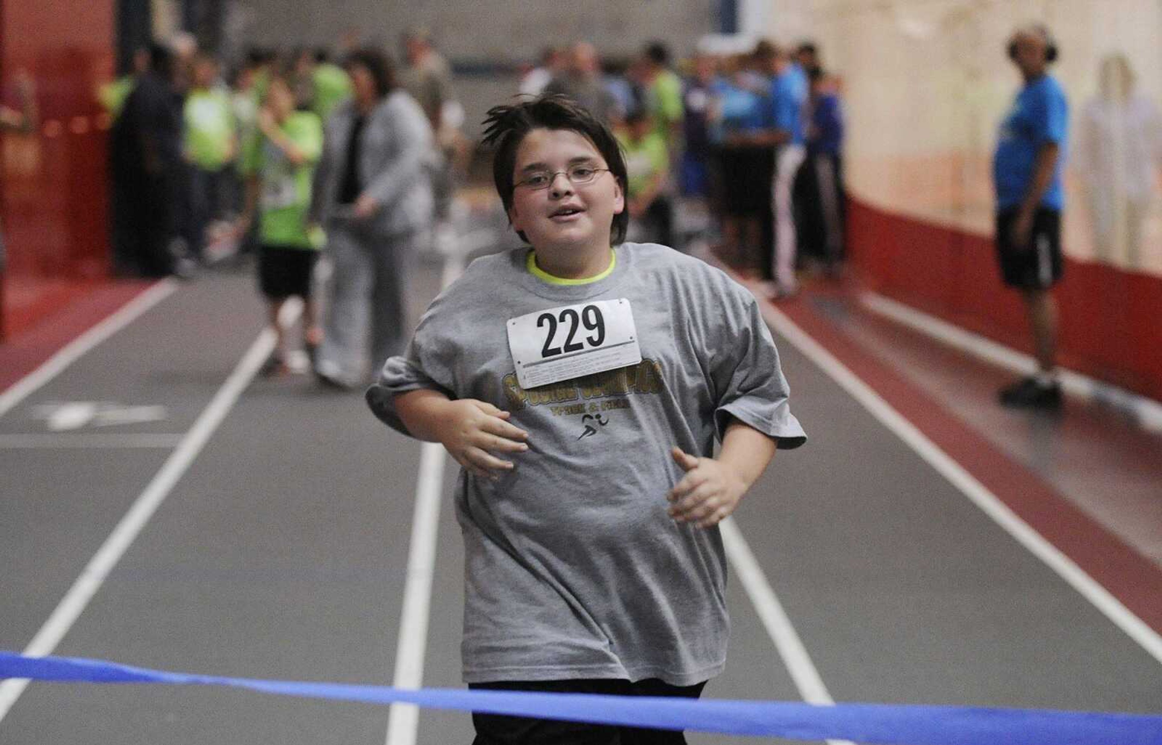 Kenneth Whitworth, 12, of Farmington races for the finish line during the Special Olympics Springs Games held at the Southeast Missouri State University Student Recreation Center Saturday, April 21. (Adam Vogler)