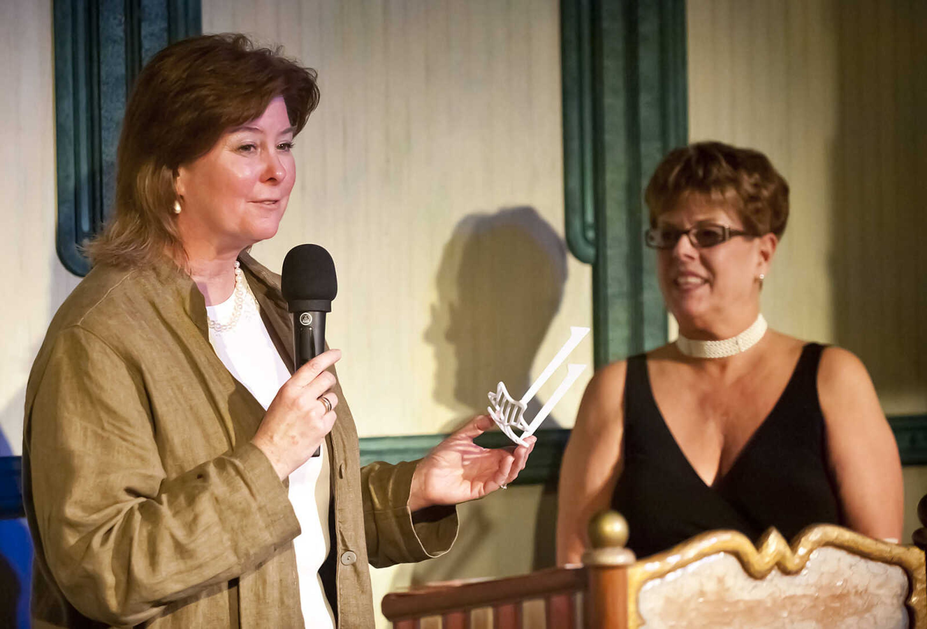 Lisa Gerlach is presented with the Vision Award during the Abbott Awards, the River City Players' annual awards ceremony, Saturday, Jan. 18, at Port Cape in downtown Cape Girardeau. Auditions for the first production of the 2014 season, "Quiet on the Set," will be held at 7 p.m. Jan. 29 and 30 at Port Cape.