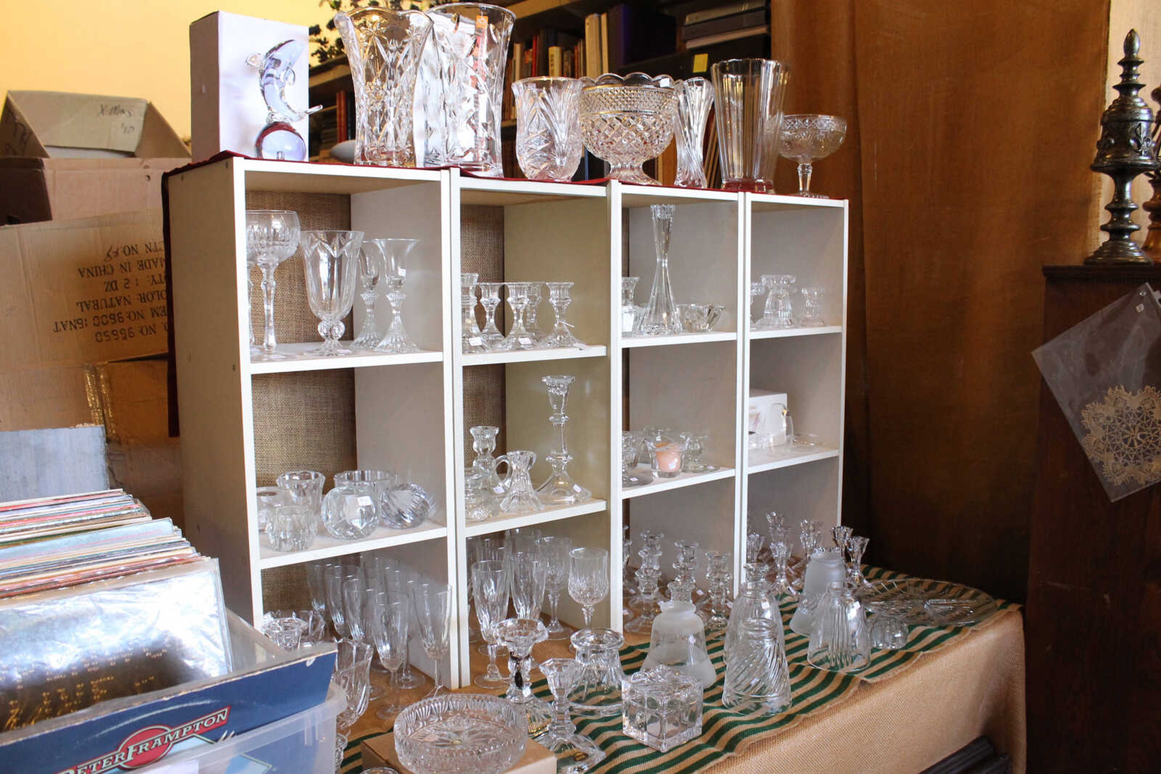 Emily Priddy ~ epriddy@semissourian.com
Glass Ń some antique and some newer Ń is displayed for sale next to a crate of vinyl records Friday, March 10, 2017, at the resale shop next door to the Union County Museum. The shop serves as a fundraiser for the museum.