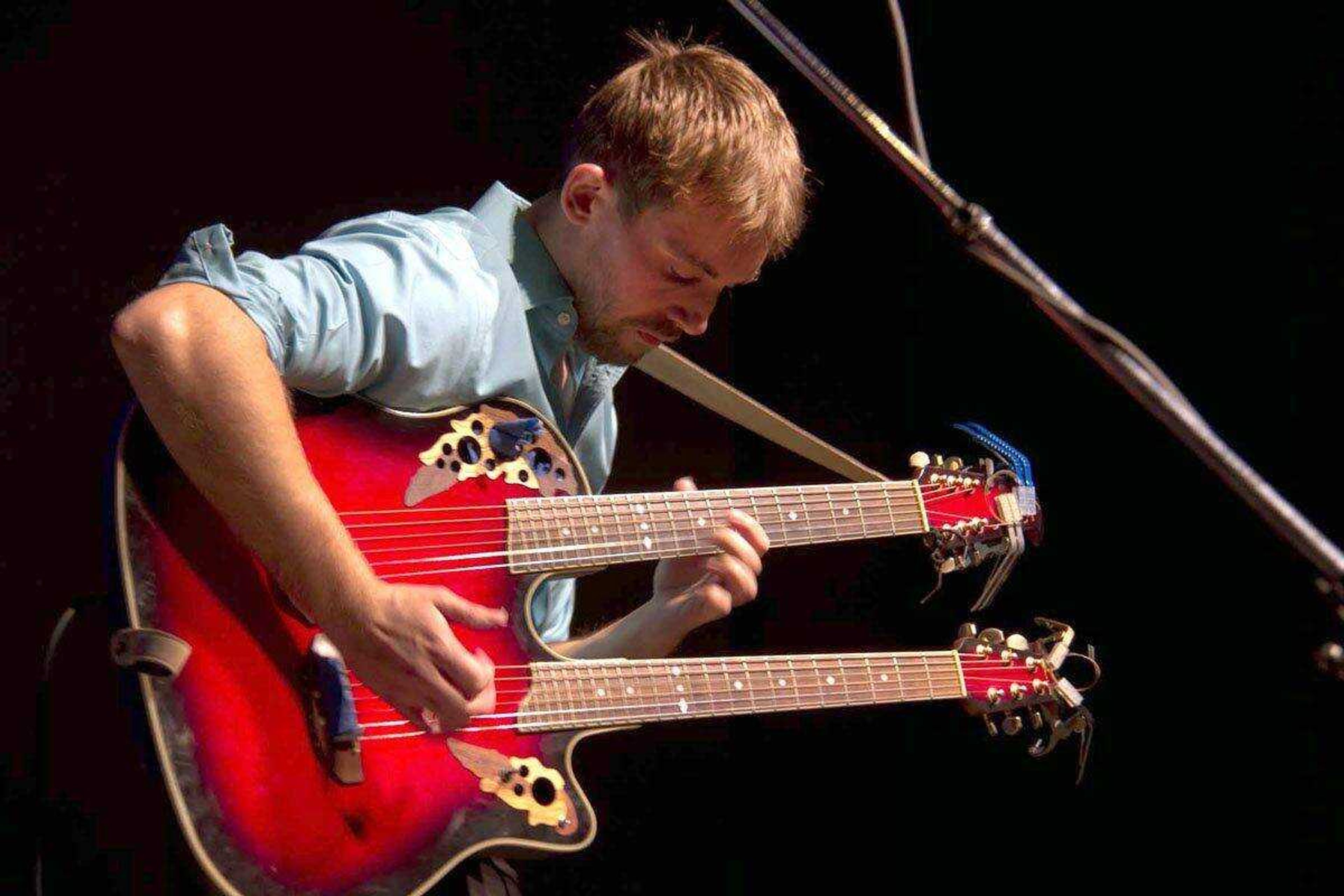 Mark Kroos performing on his double-neck guitar. (Lance Pangborn ~ Submitted photo)