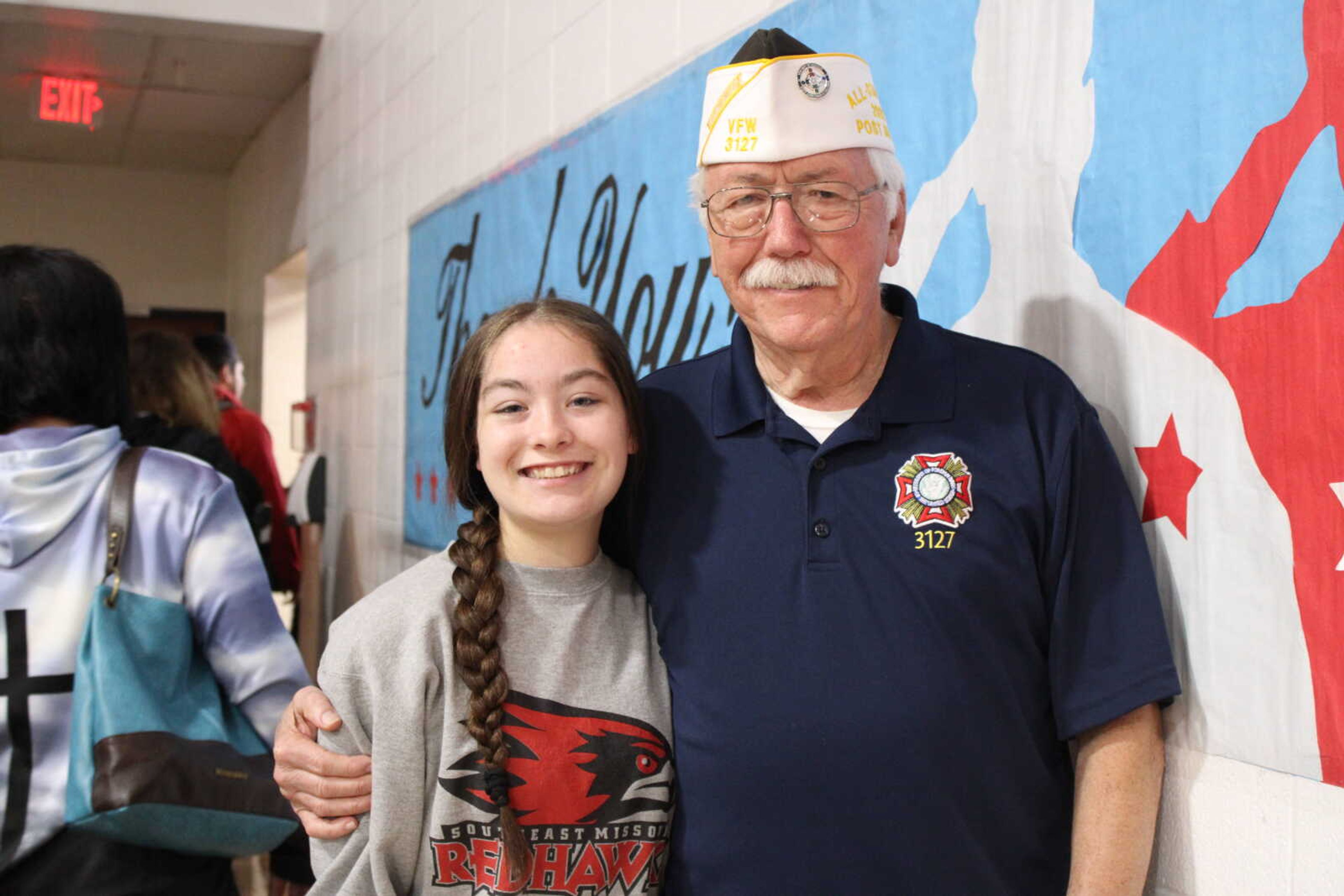 Julie Myers and Veteran Darrell Champman take a photo together&nbsp;