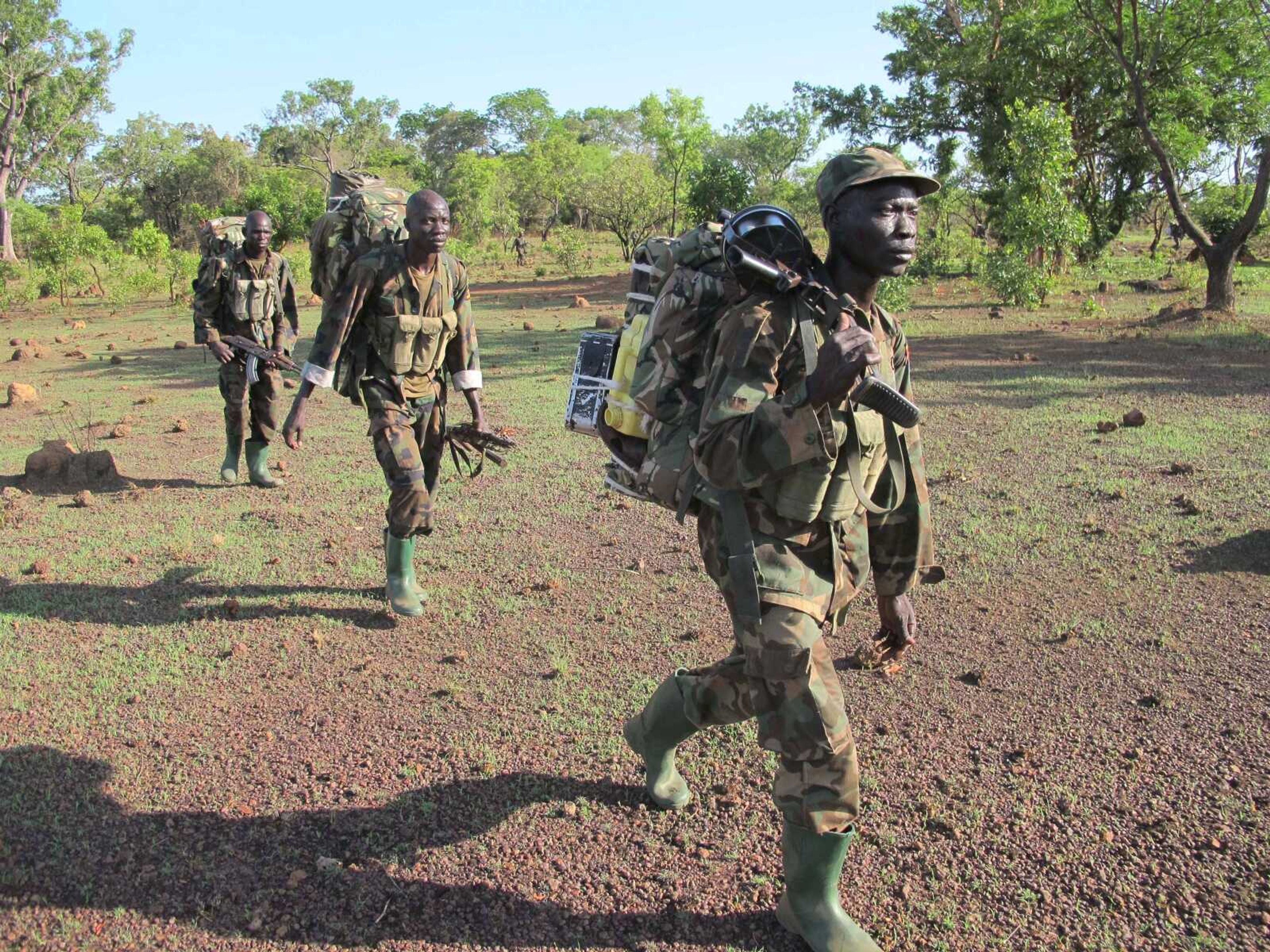 Ugandan soldiers hunting for fugitive warlord Joseph Kony deep in the Central African Republic jungle Thursday patrol the area. (Rodney Muhumuza ~ Associated Press)