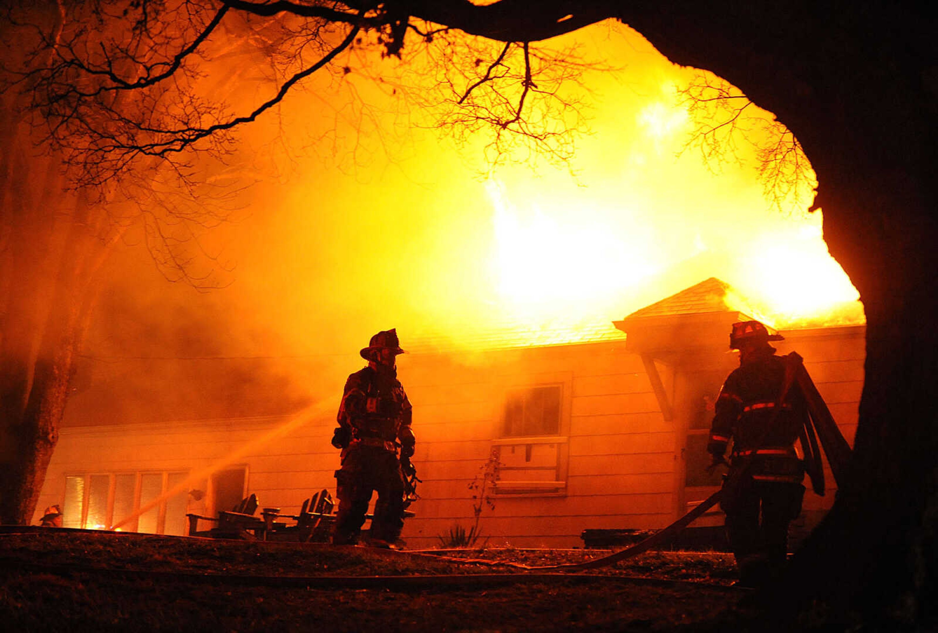 LAURA SIMON ~ lsimon@semissourian.com
Firefighters from Delta, Gordonville, Cape Girardeau, Millersville, Fruitland and East County Fire Departments battle a structure fire Wednesday night, January 9, 2012 on Onyx Lane in Cape Girardeau.