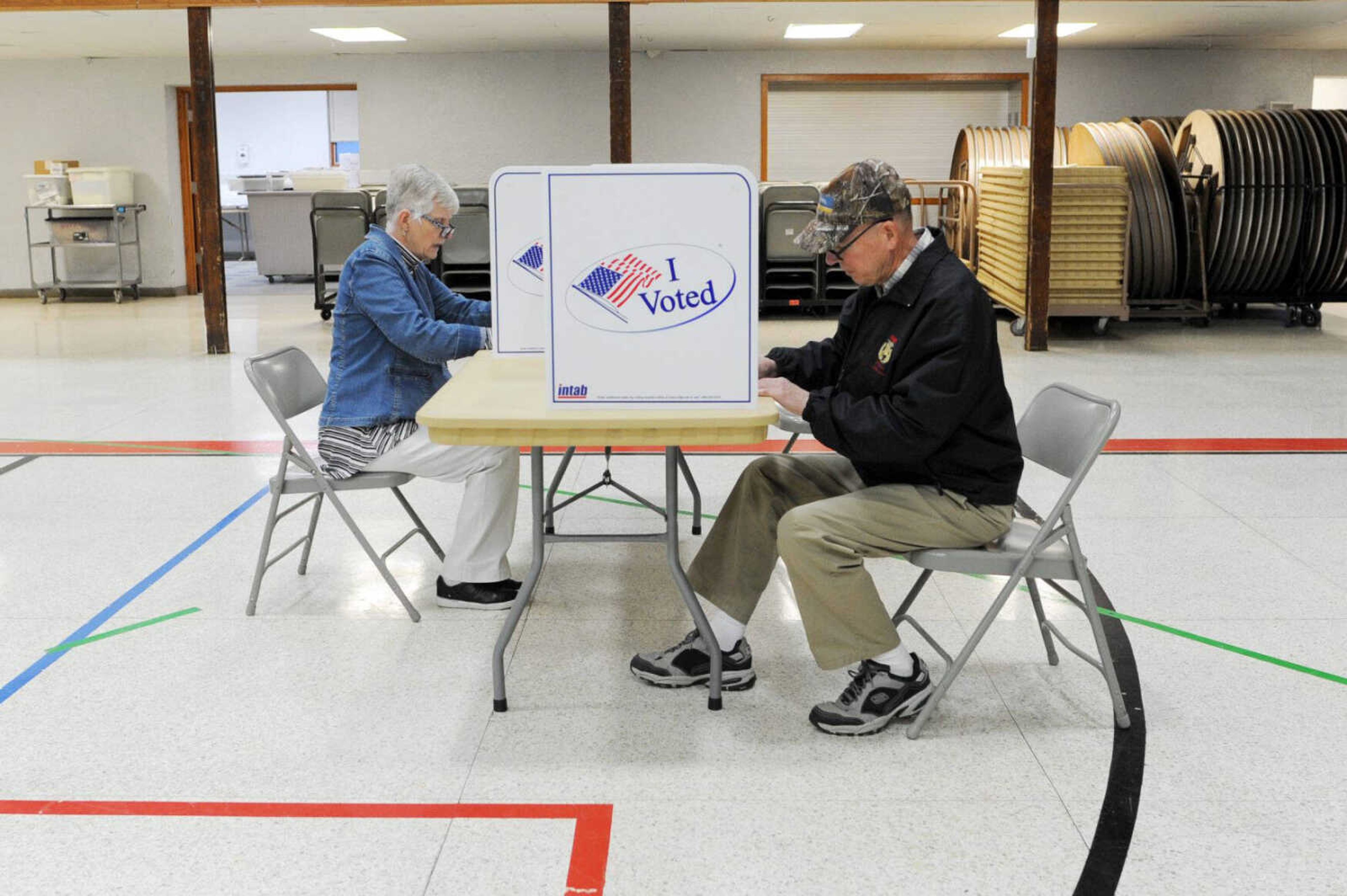 Joanne Jordan, left, and David Jordan vote Tuesday at the Arena Building in Cape Girardeau.