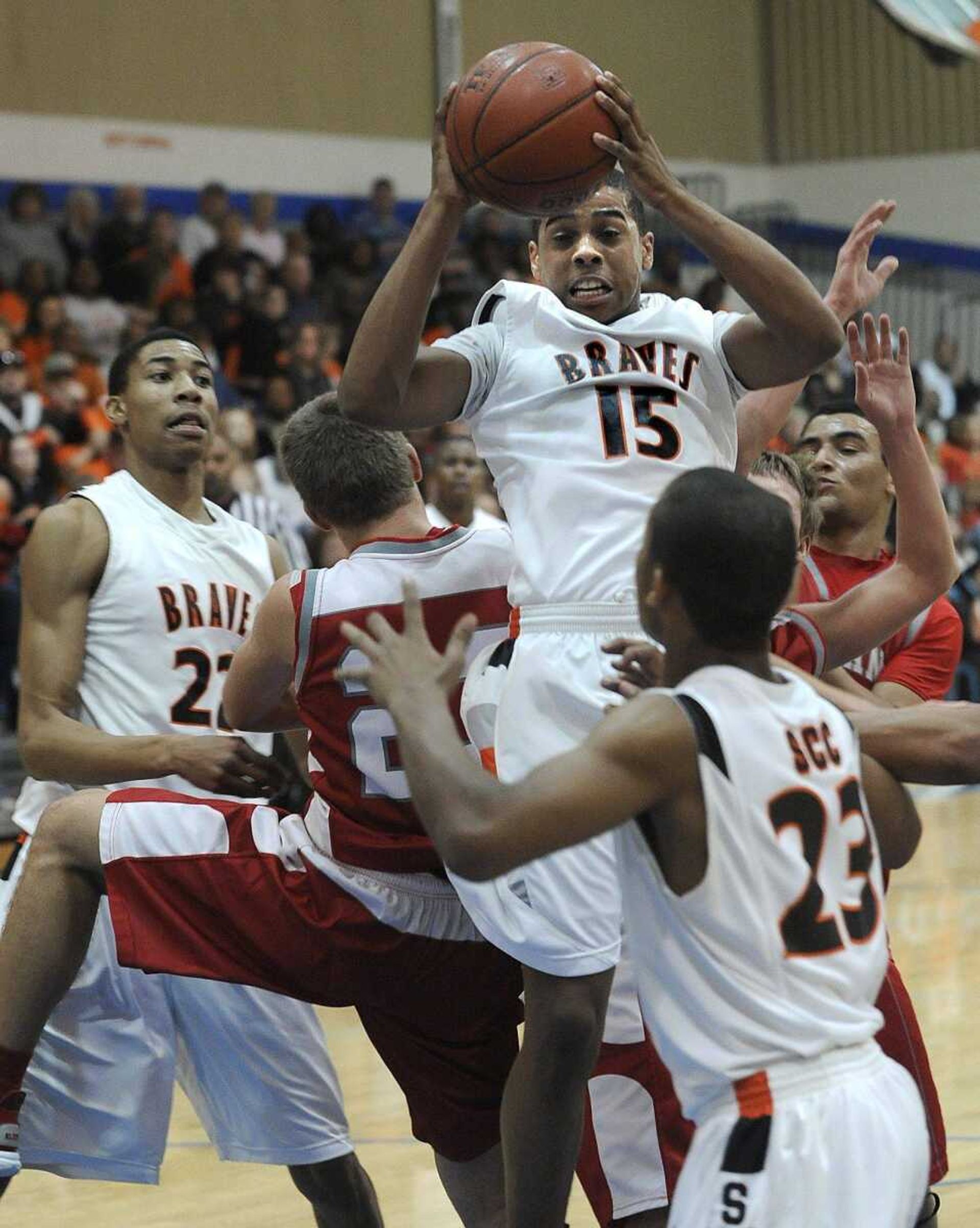 Scott County Central's Trey Johnson pulls down a rebound against Richland during the first quarter of the Class 1 District 3 championship game Thursday in Delta, Mo.FRED LYNCHflynch@semissourian.com