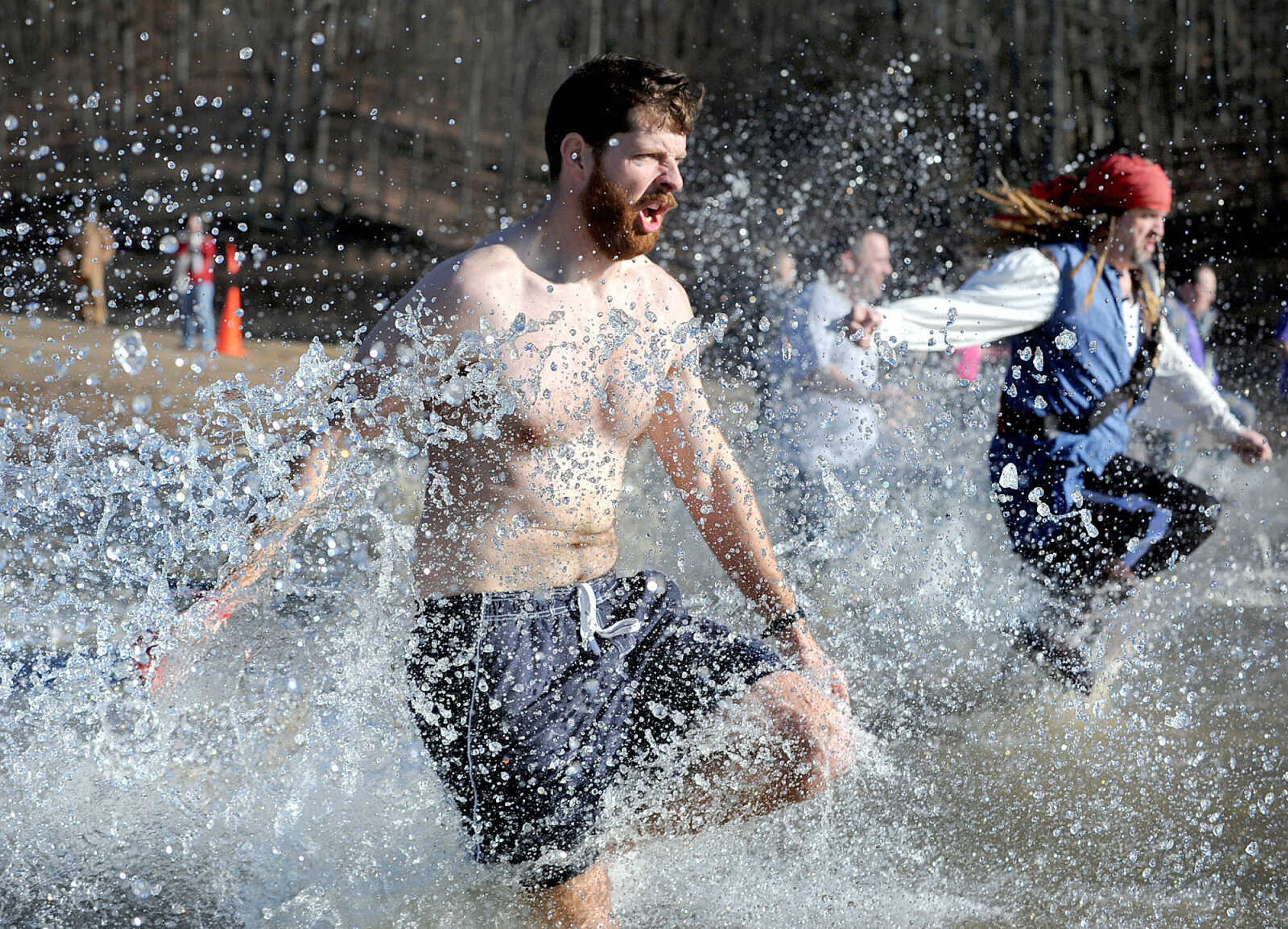 LAURA SIMON ~ lsimon@semissourian.com
People plunge into the cold waters of Lake Boutin Saturday afternoon, Feb. 2, 2013 during the Polar Plunge at Trail of Tears State Park. The lake's water temperature Saturday was 28 degrees. Thirty-six teams totaling 291 people took the annual plunge that benefits Special Olympics. Each team has to raise a minimum of 75 dollars to participate.