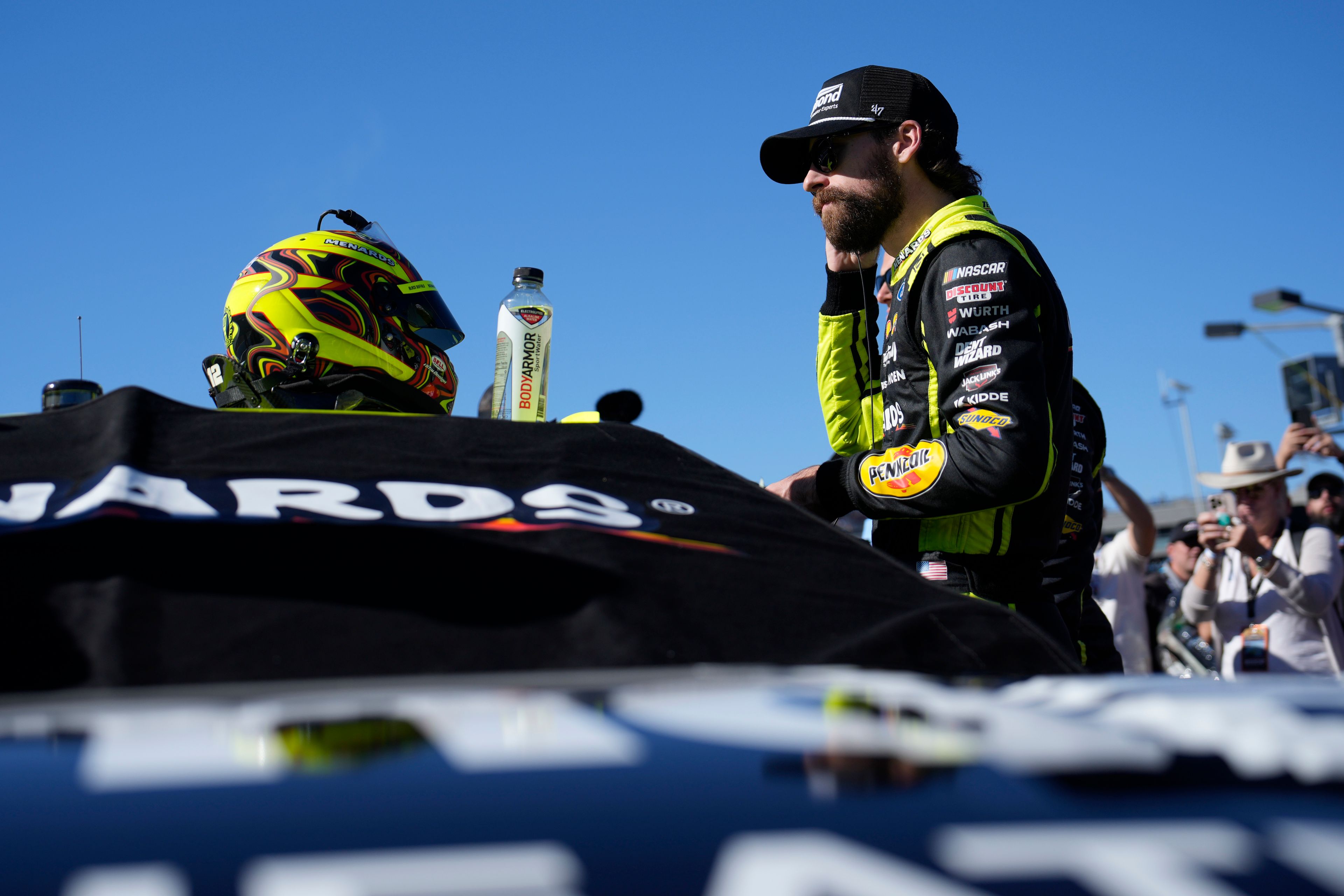 Ryan Blaney prepares to get into his car before a NASCAR Cup Series Championship auto race at Phoenix Raceway, Sunday, Nov. 10, 2024, in Avondale, Ariz. (AP Photo/John Locher)