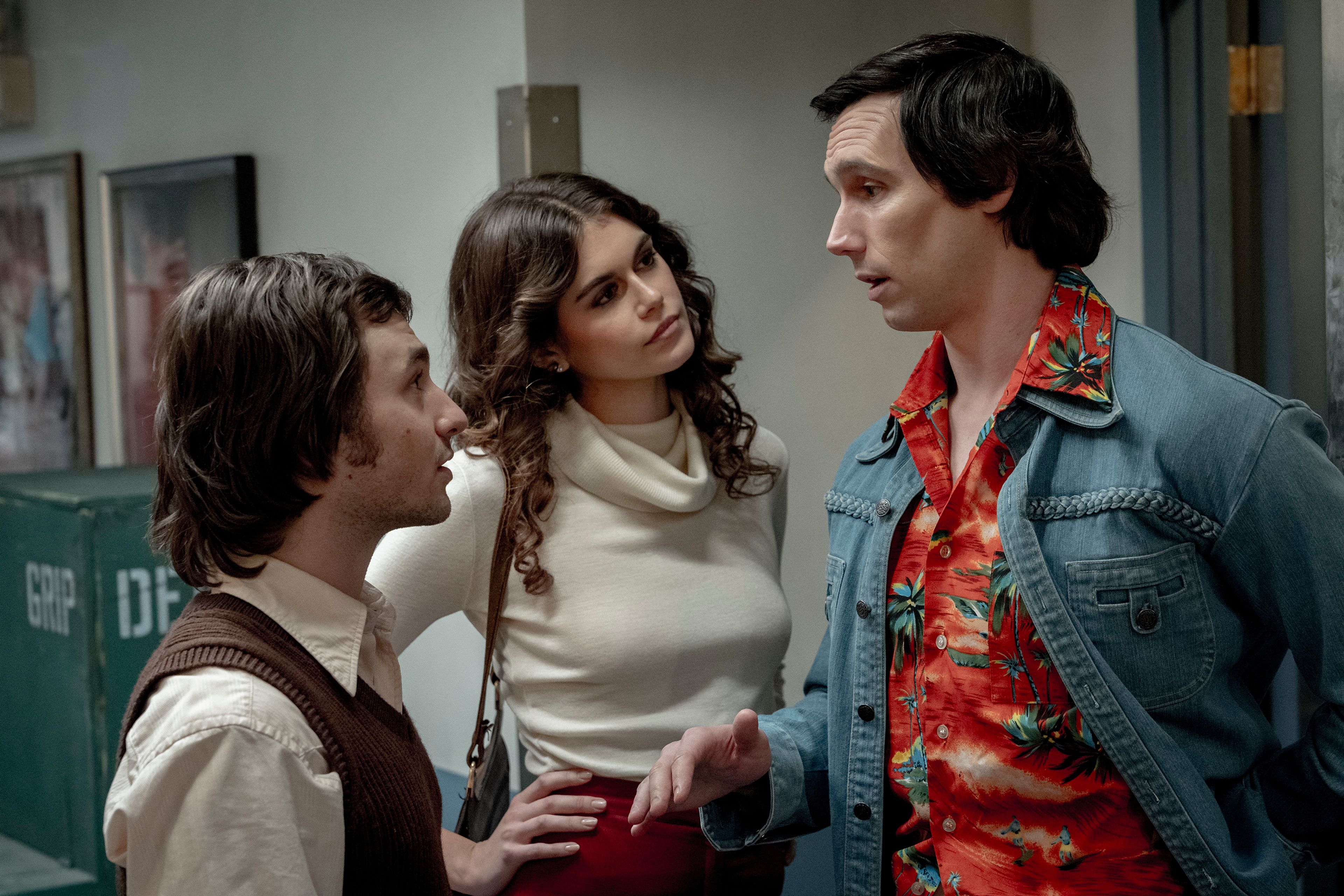 This image released by Sony Pictures shows Gabriel LaBelle as Lorne Michaels, left, Kaia Gerber as Jacqueline Carlin, center, and Cory Michael Smith as Chevy Chase in a scene from "Saturday Night." (Hopper Stone/Sony Pictures via AP)