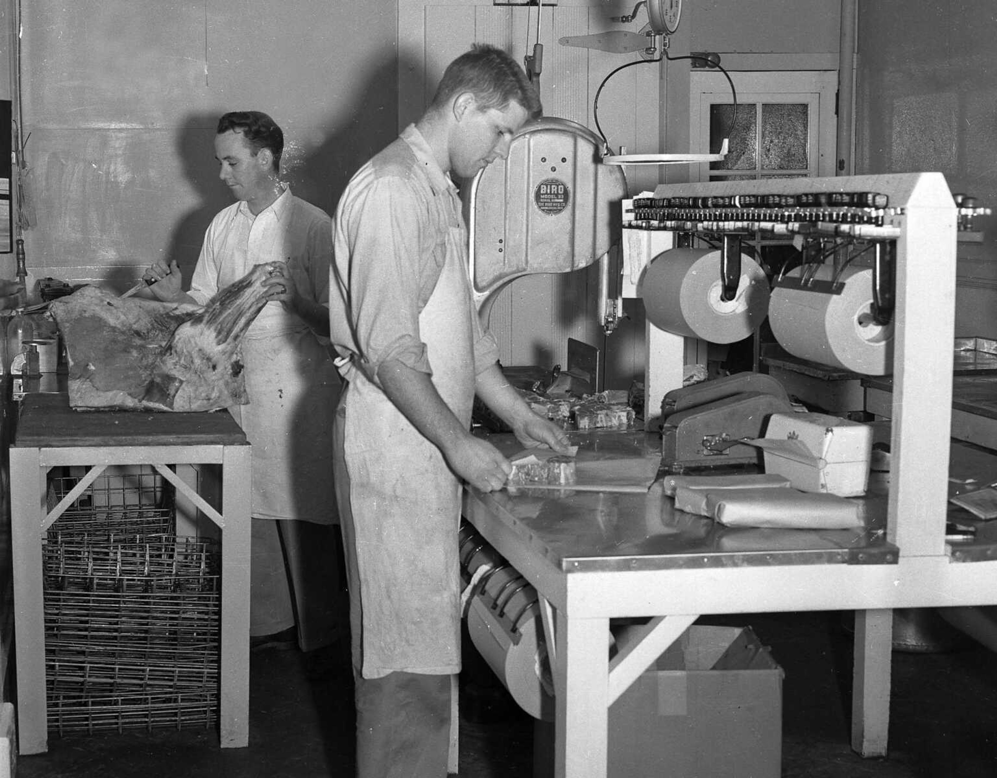 Dec. 13, 1954 Southeast Missourian.
John Huckstep and Warren Blankenship in processing room where all meats are cut and packaged for quick freezing at Cape Frozen Food Center. (G.D. Fronabarger photo)