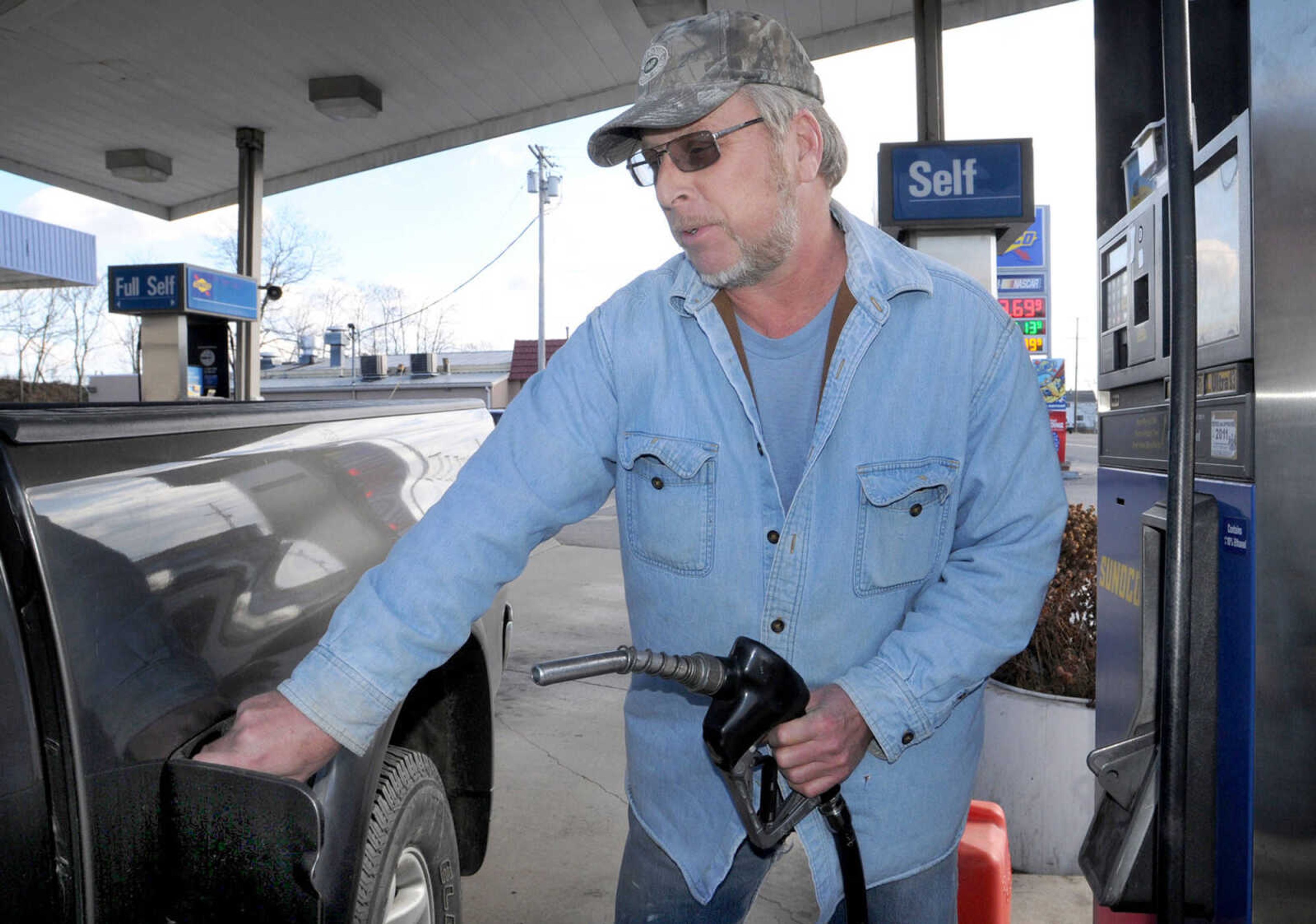 In this Thursday, February 23, 2012, Steve Spencer, who owns Spencer Construction, buys gas for his work truck at Miller's Sunoco, in Chambersburg, Pa. U.S. drivers will pay an average of 24 cents more per gallon for gasoline during this summer's travel season, the government said Tuesday, April 10, 2012. The Energy Information Administration said gasoline should cost an average of $3.95 per gallon from April through September, an increase of 6.3 percent from the same period last year. (AP Photo/Public Opinion, Markell DeLoatch)