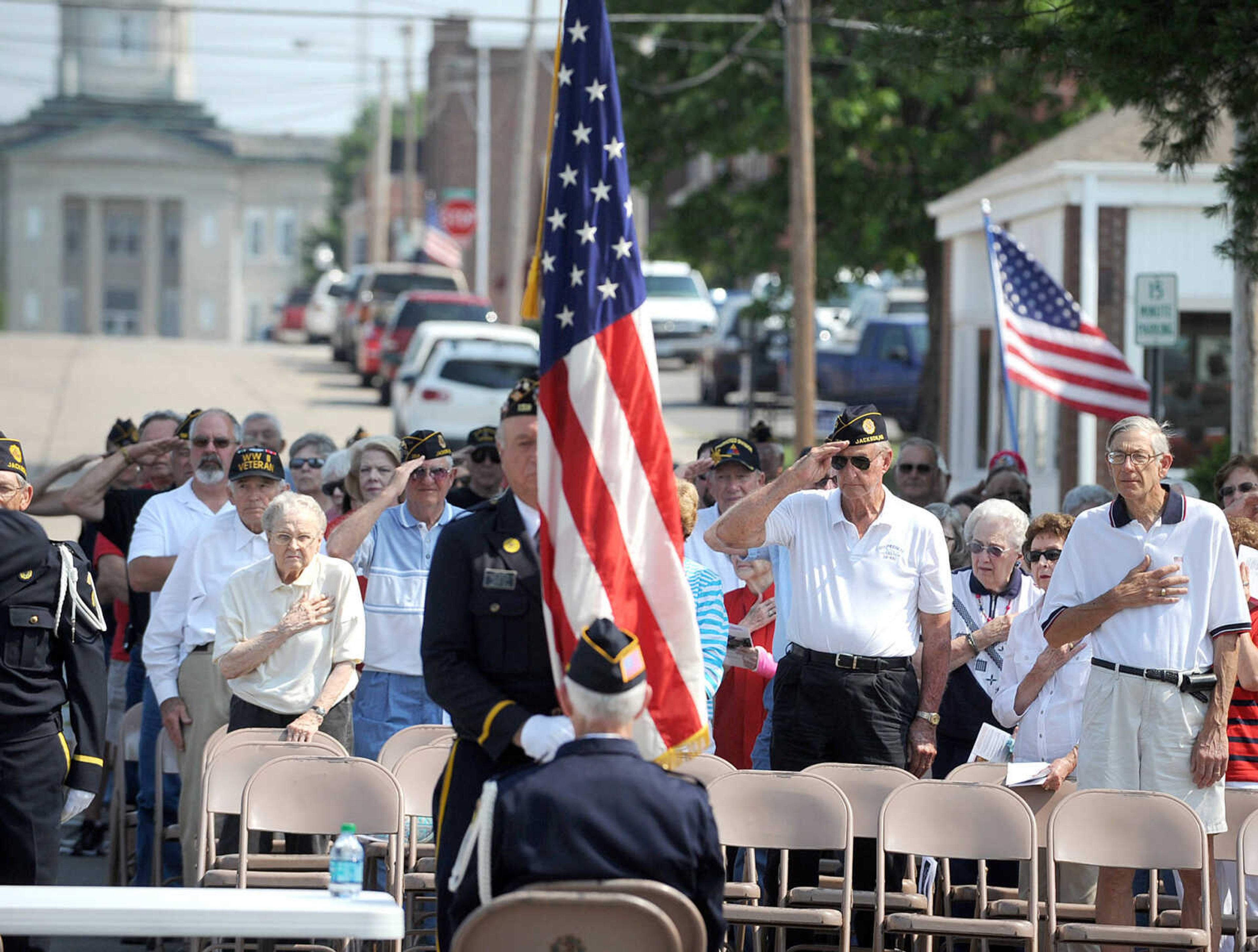 LAURA SIMON ~ lsimon@semissourian.com
The crowd pays tribute during the retiring of the colors Monday morning, May 28, 2012 at the Memorial Day service at Jackson City Cemetery.