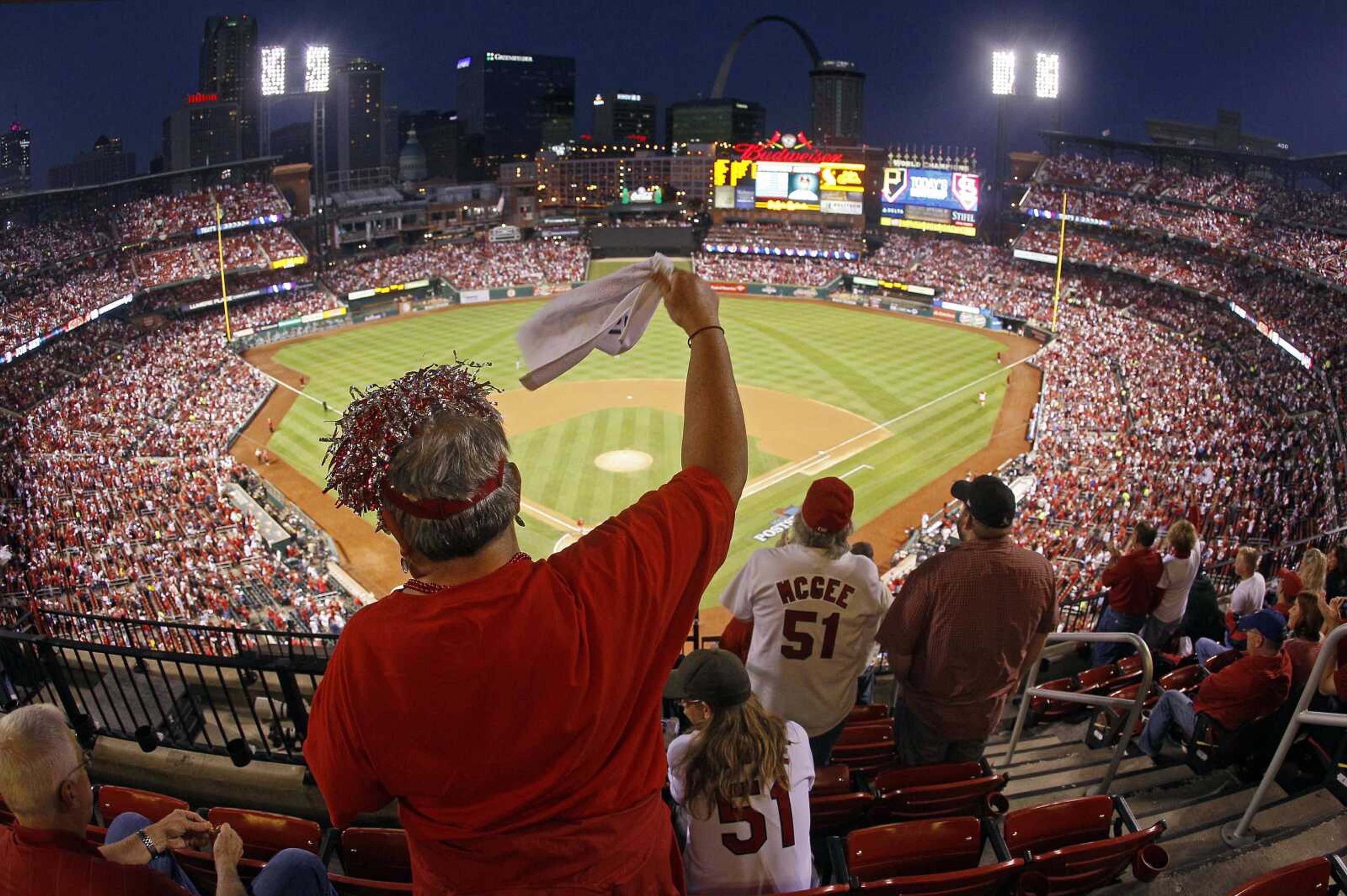 St. Louis Cardinals fan Dawn Schallenberg, of Bethalto, Ill., cheers as the Cardinals are introduced before Game 5 of a National League baseball division series against the Pittsburgh Pirates on Wednesday, Oct. 9, 2013, in St. Louis. (AP Photo/Mark Humphrey)