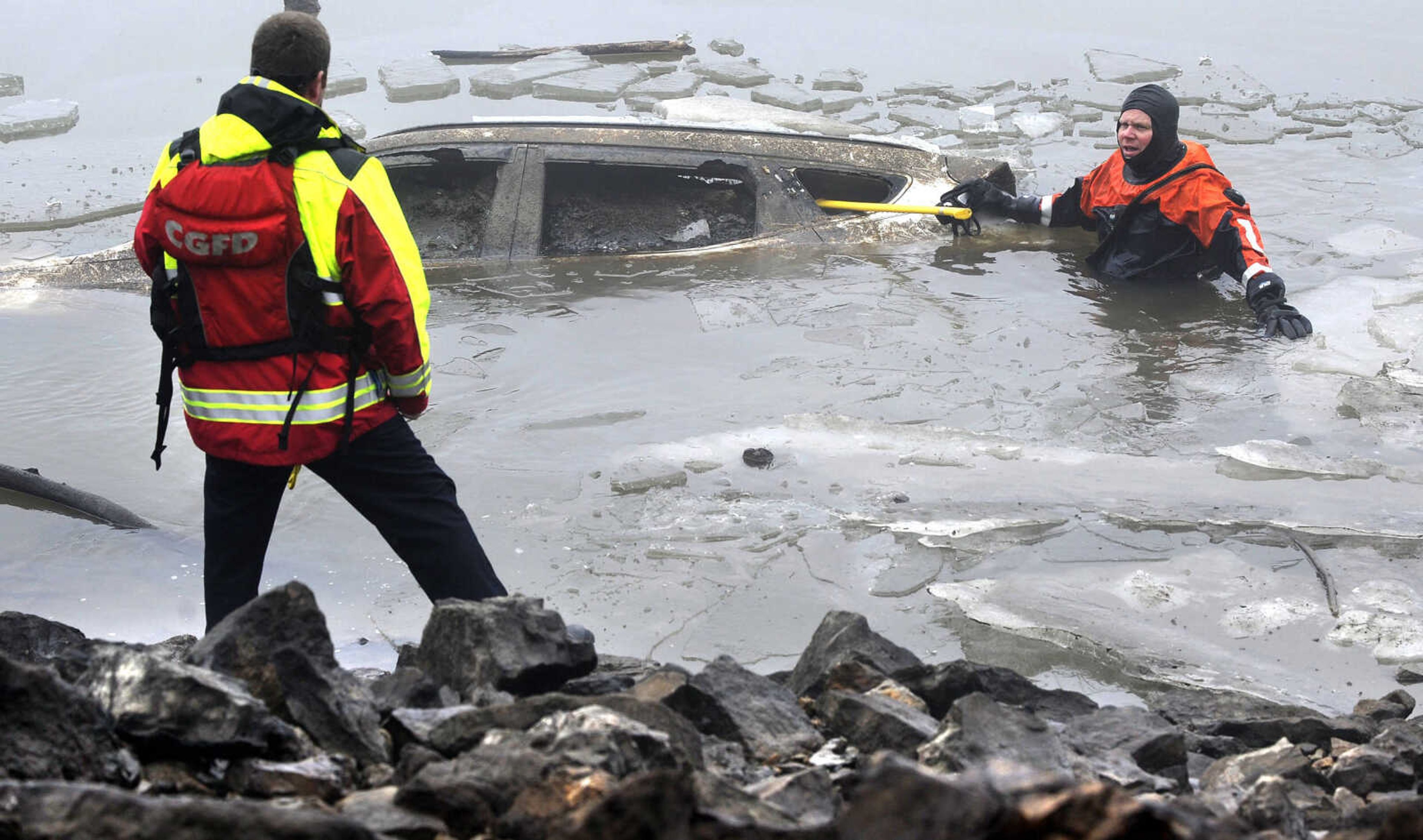 FRED LYNCH ~ flynch@semissourian.com
Capt. Jeff Crites of the Cape Girardeau Fire Department surfaces Wednesday, Jan. 10, 2018 from the Mississippi River south of the Red Star Access. He was unable to obtain identification on the submerged SUV that has been locked in the ice.