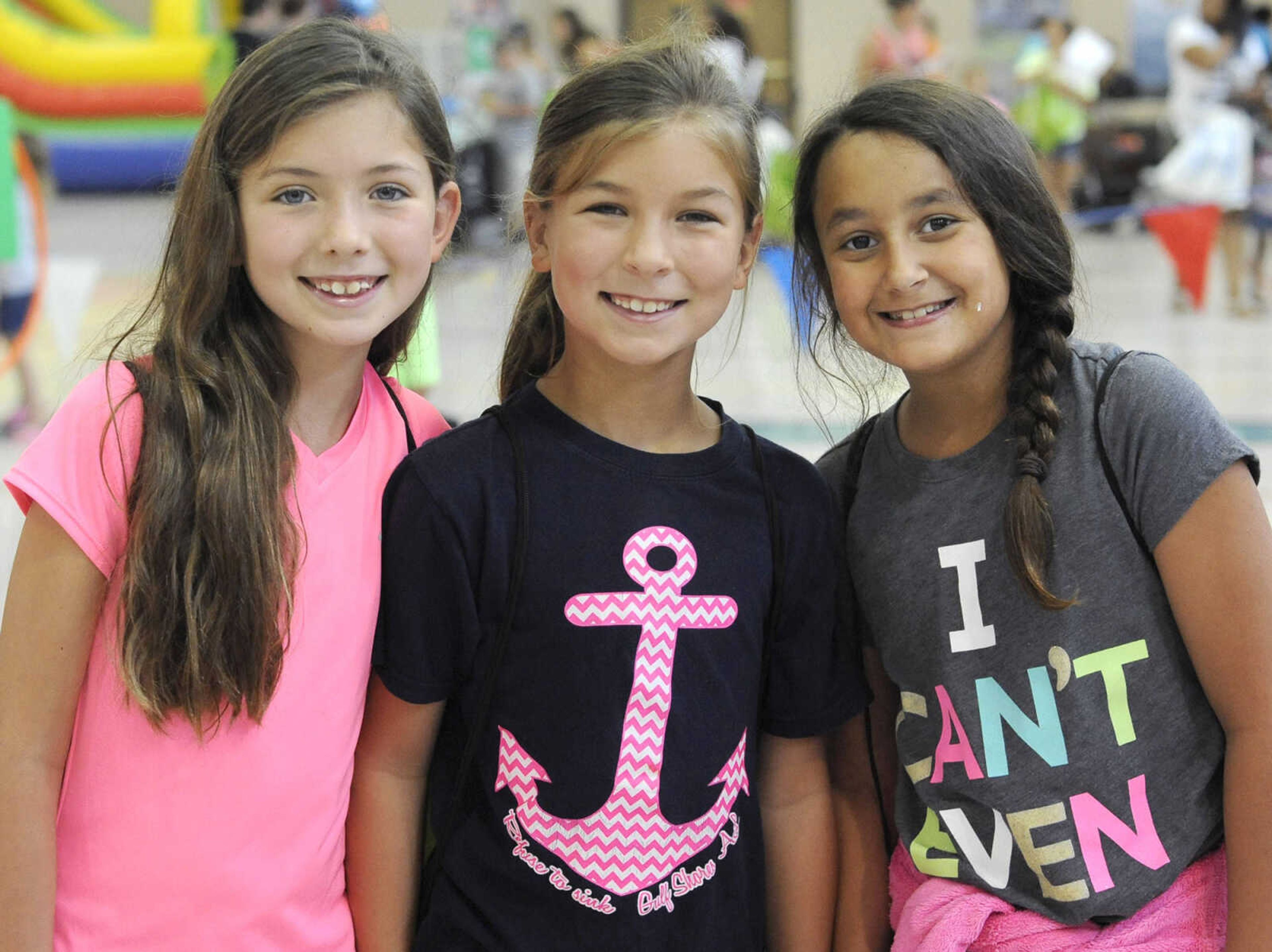 Savannah Jones, left, Anna Jones and Lydia Strohmeyer pose for a photo Friday, July 8, 2016 at Parks and Rec Day at the Osage Centre.