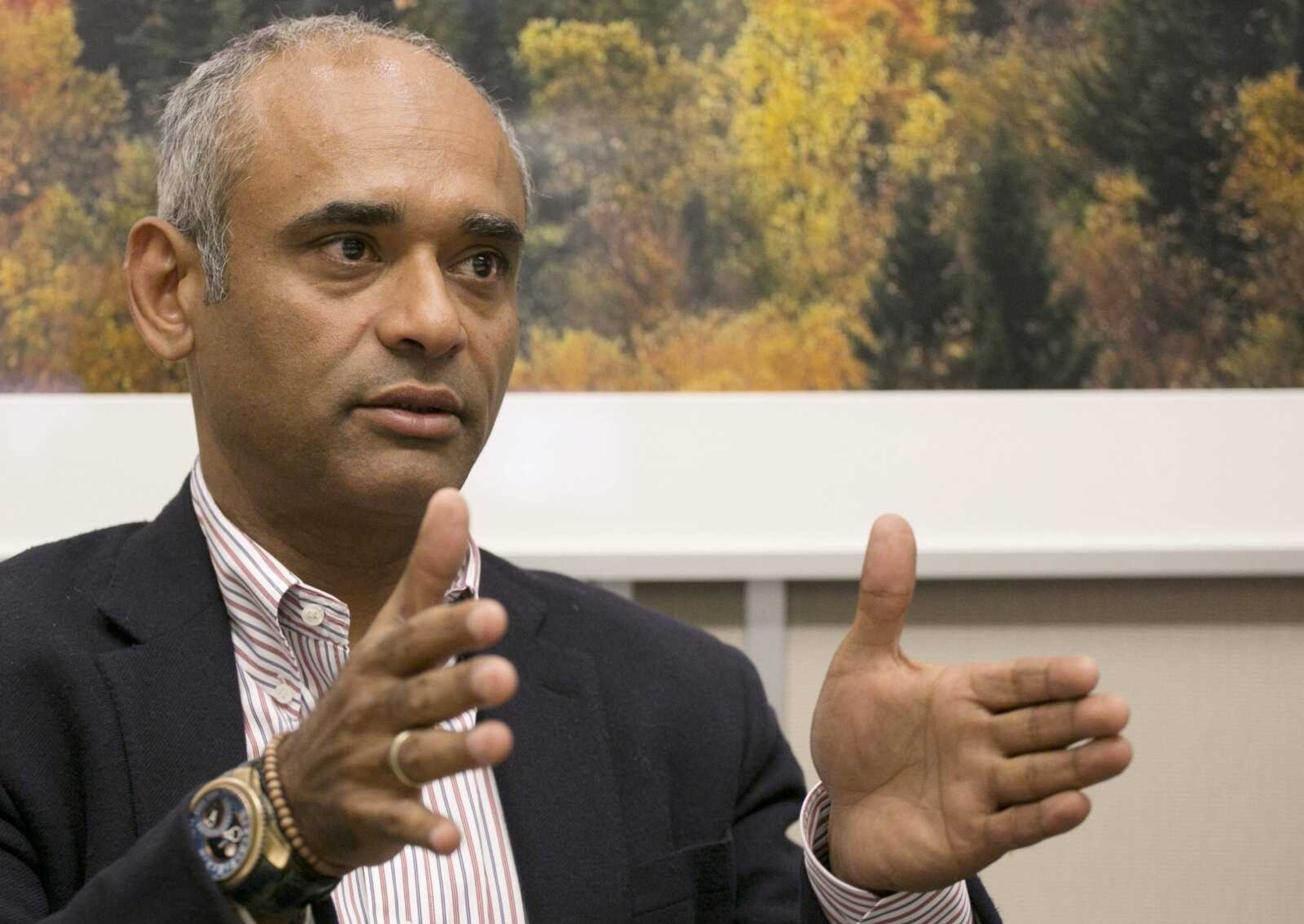 Chet Kanojia, founder and CEO of Aereo, speaks during an interview March 26 in New York. The future of Aereo, an online service that provides over-the-air TV channels, hinges on a battle with broadcasters that is before the U.S. Supreme Court. (Mark Lennihan ~ Associated Press)