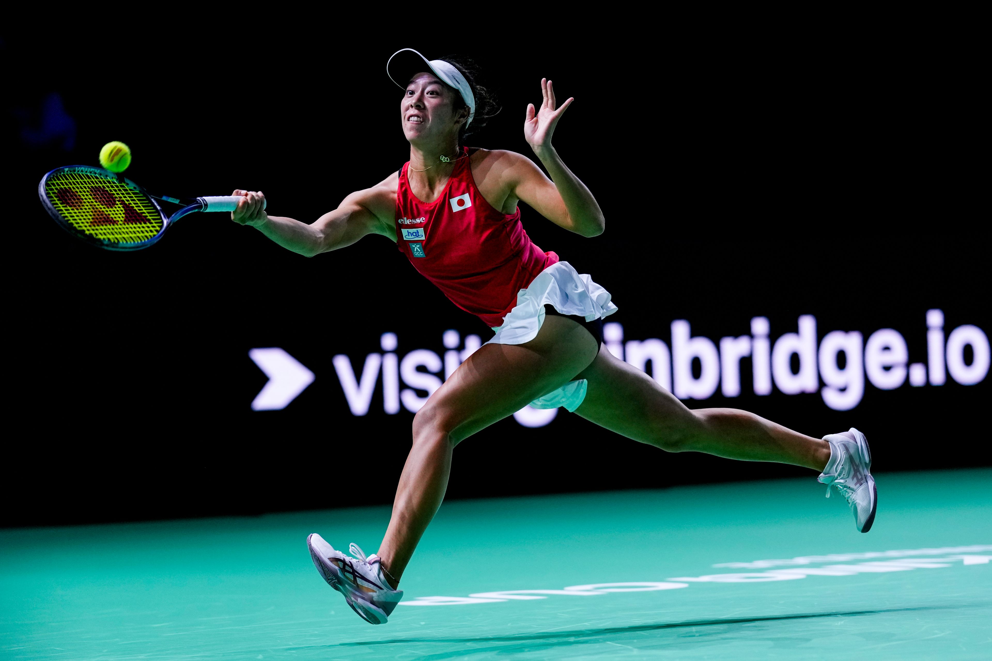 Japan's Ena Shibahara returns the ball against Romania's Jaqueline Cristian during the Billie Jean King Cup Finals, at the Martin Carpena Sports Hall, in Malaga, southern Spain, on Thursday, Nov. 14, 2024. (AP Photo/Manu Fernandez)