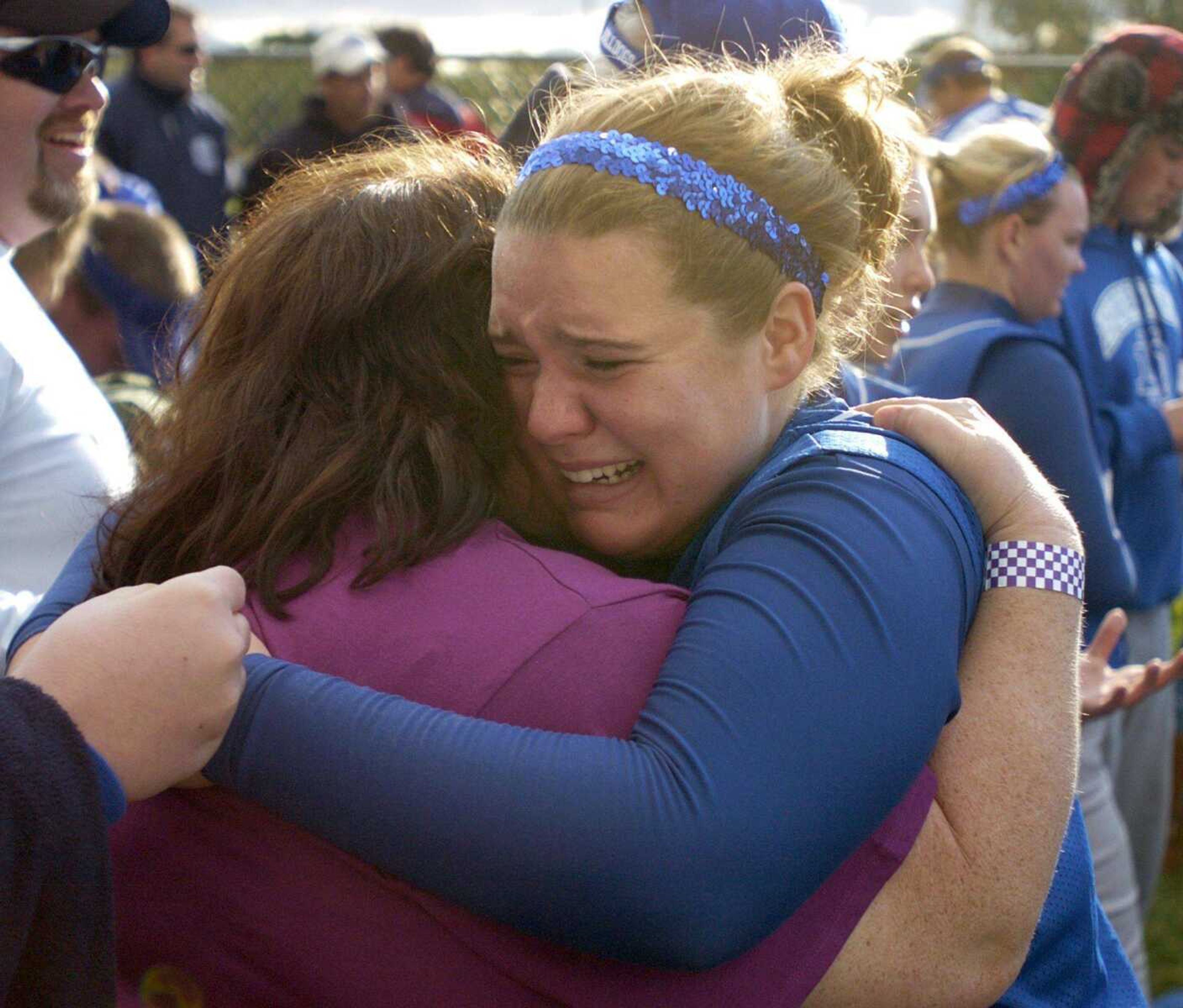 Nikki Chambers of Notre Dame celebrates with her family after Friday's 13-inning victory against Kirksville.