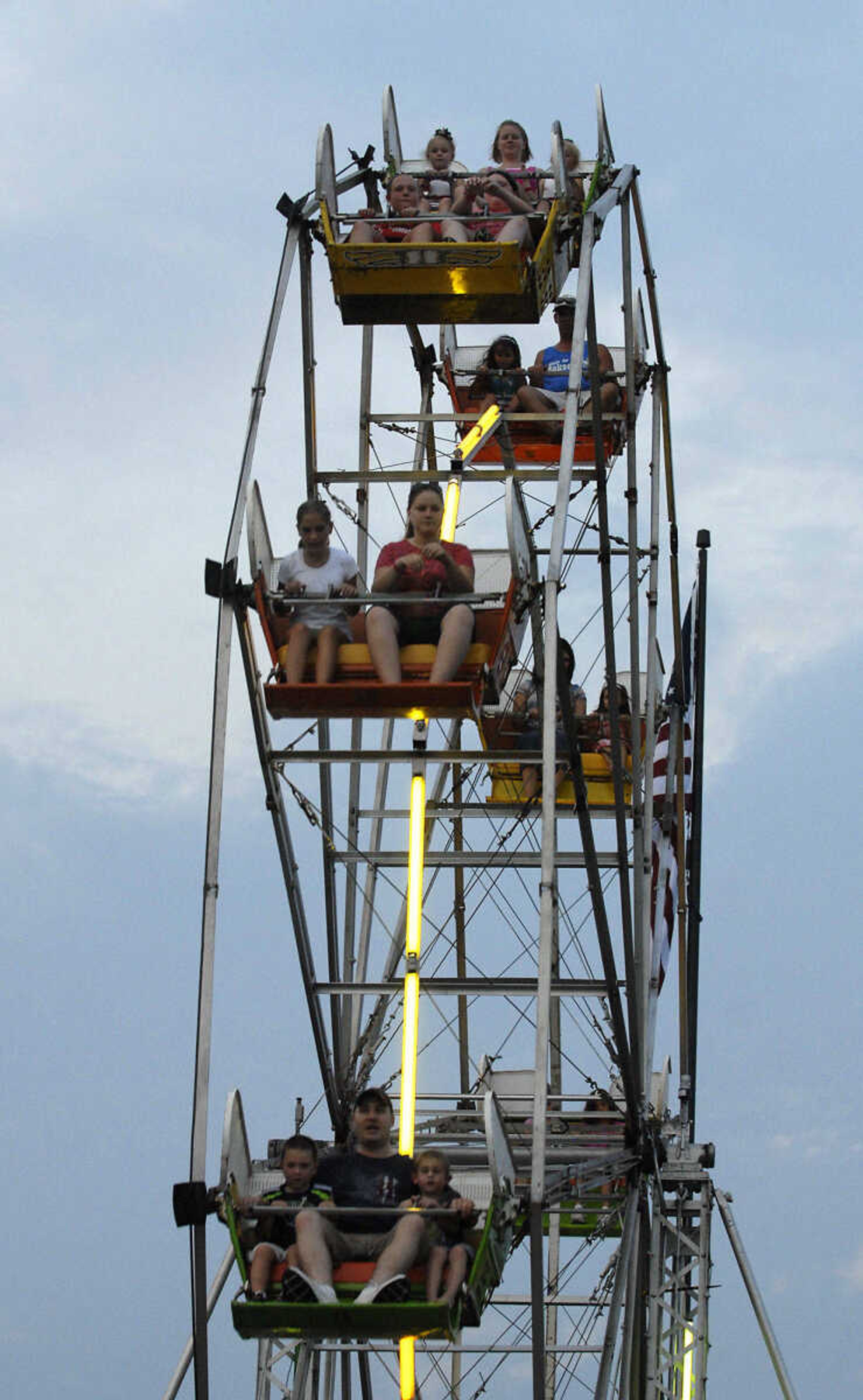 KRISTIN EBERTS ~ keberts@semissourian.com

The Ferris Wheel towers over the crowds at the 102nd Annual Homecomers Celebration in Jackson, Mo., on Thursday, July 29, 2010.