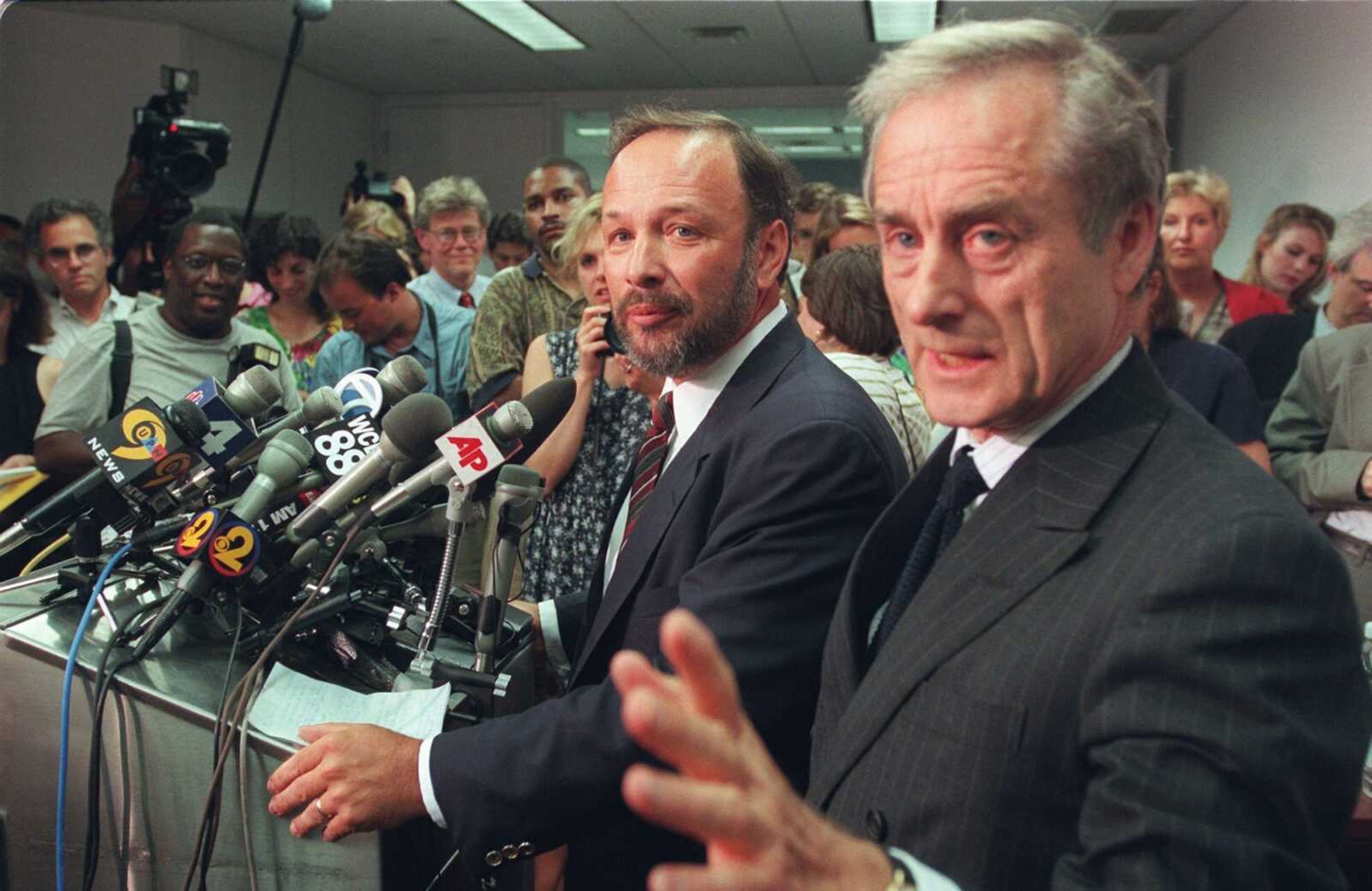 Author of "Primary Colors" Joe Klein, center, and Random House president Harry Evans hold a news briefing July 17, 1996, in New York. Klein, a Newsweek columnist, identified himself as the author of the best-selling satire of the Bill Clinton 1992 presidential campaign.