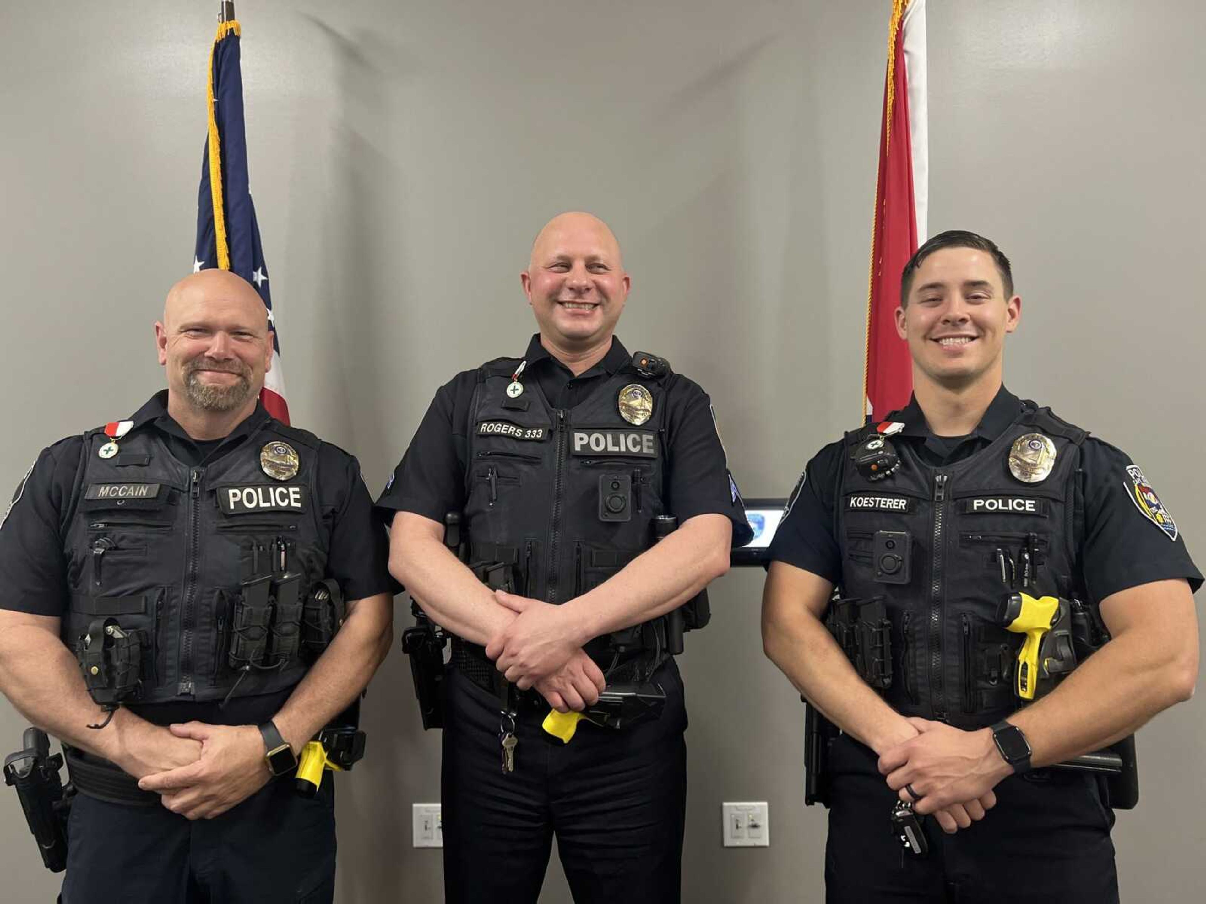 Cape Girardeau police officer Brian McCain, left, Cpl. Will Rogers, center, and Joel Koesterer were honored Thursday, April 20, by the National Society of Sons of the American Revolution for lifesaving efforts during a January rescue.