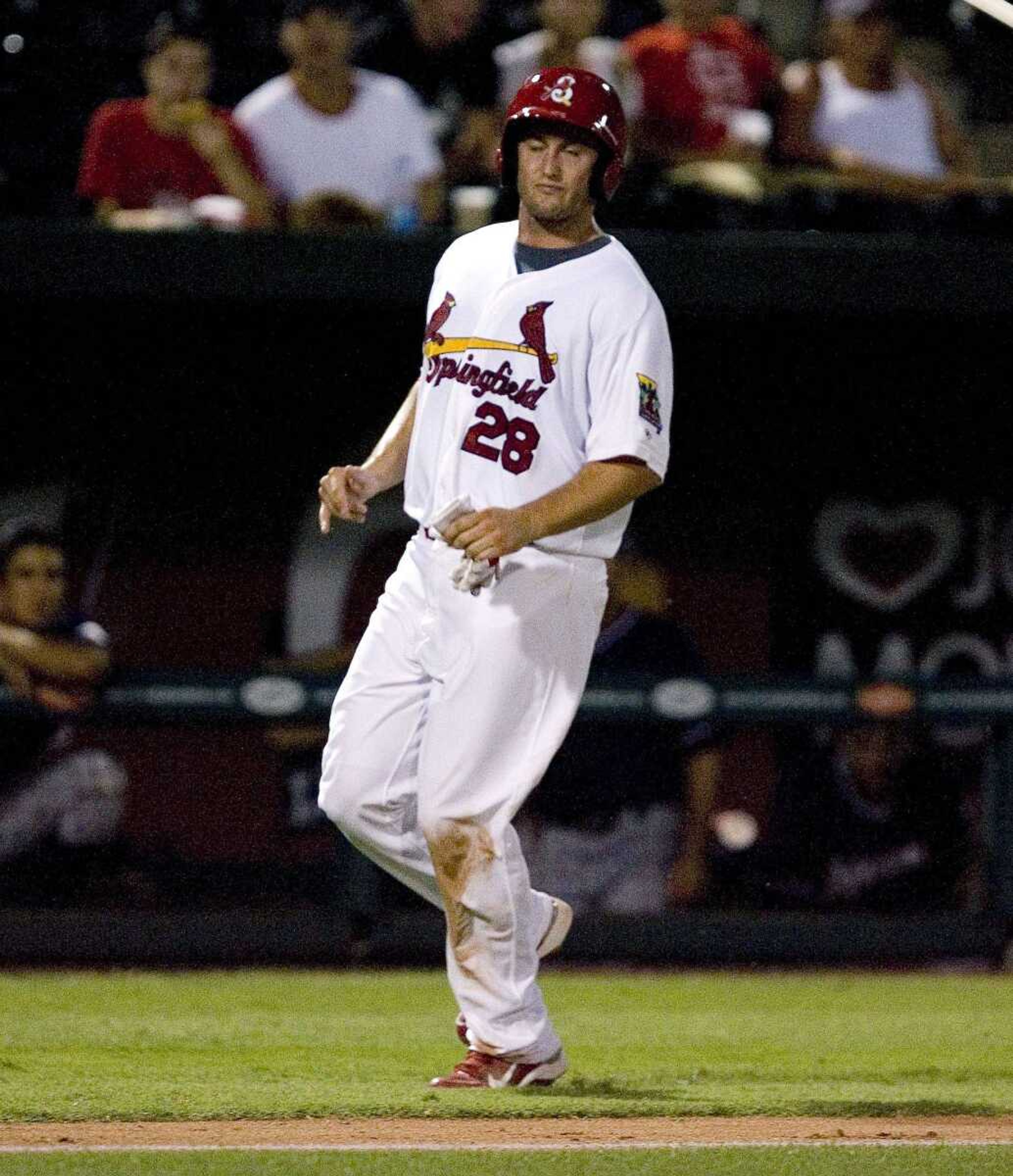 St. Louis Cardinals' David Freese pulls up after rounding third while heading for home plate during a Springfield Cardinals game against the Northwest Arkansas Naturals on Monday, Aug. 2, 2010, in Springfield, Mo. Freese strained his lower right leg during the rehab assignment, and will return to St. Louis to be evaluated. (AP Photo/Springfield News-Leader, Nathan Papes)