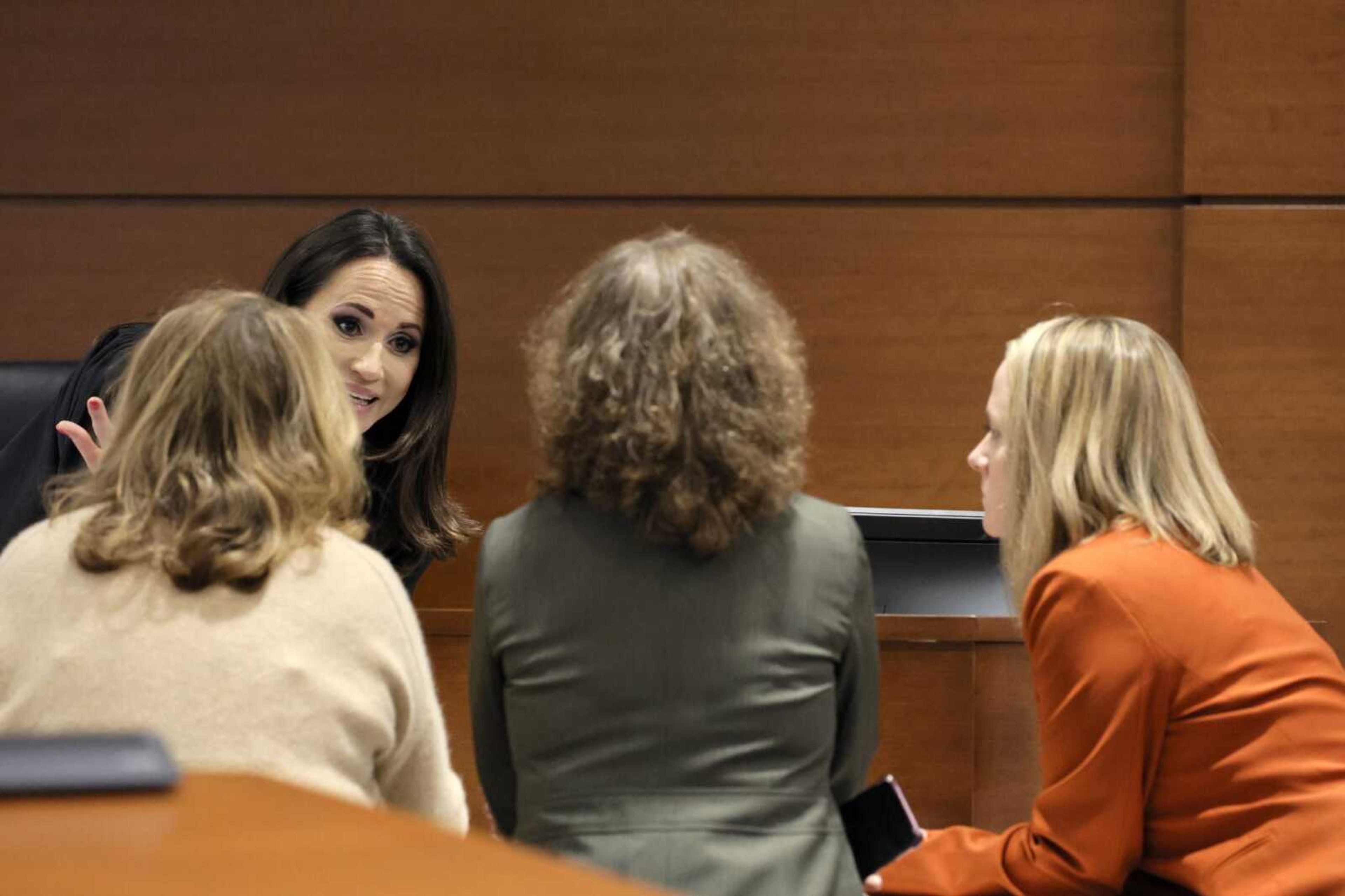 Judge Elizabeth Scherer speaks with, from left, assistant state attorney Carolyn McCann, and assistant public defenders Tamara Curtis and Melisa McNeill during a break in jury pre-selection in the penalty phase of the trial of Marjory Stoneman Douglas High School shooter Nikolas Cruz on Tuesday at Broward County Courthouse in Fort Lauderdale, Florida.