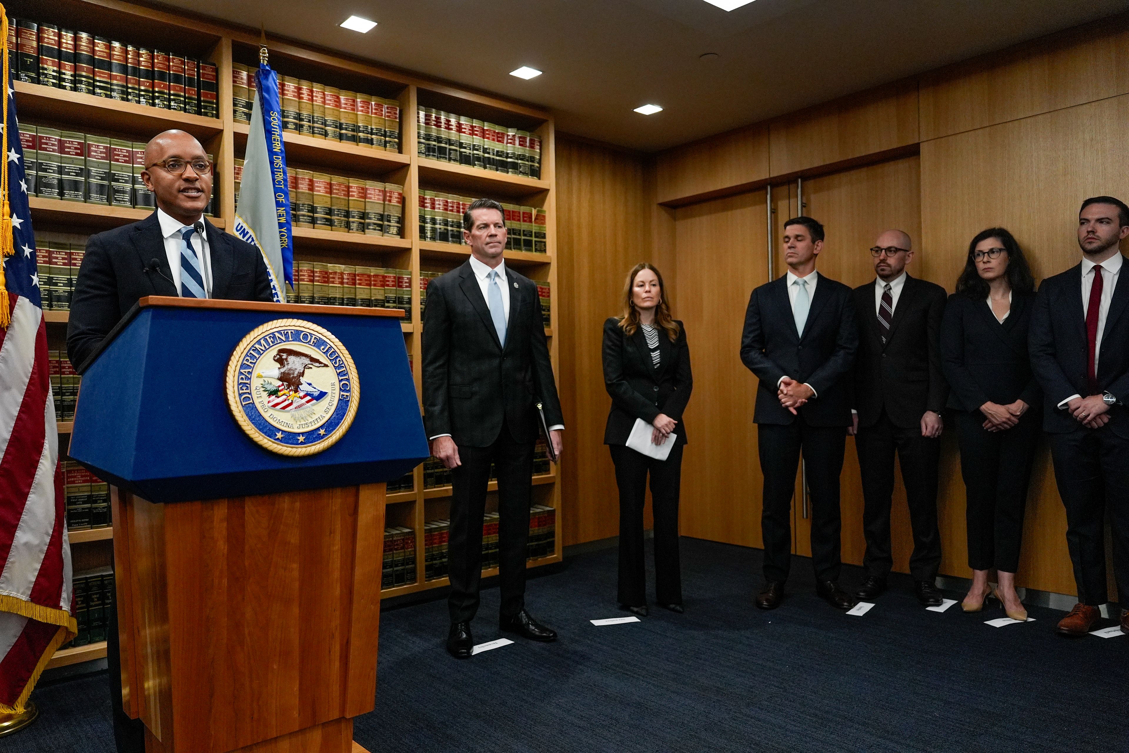 U.S. Attorney Damian Williams, left, speaks at a news conference detailing an indictment against New York City Mayor Eric Adams, Thursday, Sept. 26, 2024, in New York. (AP Photo/Julia Demaree Nikhinson)