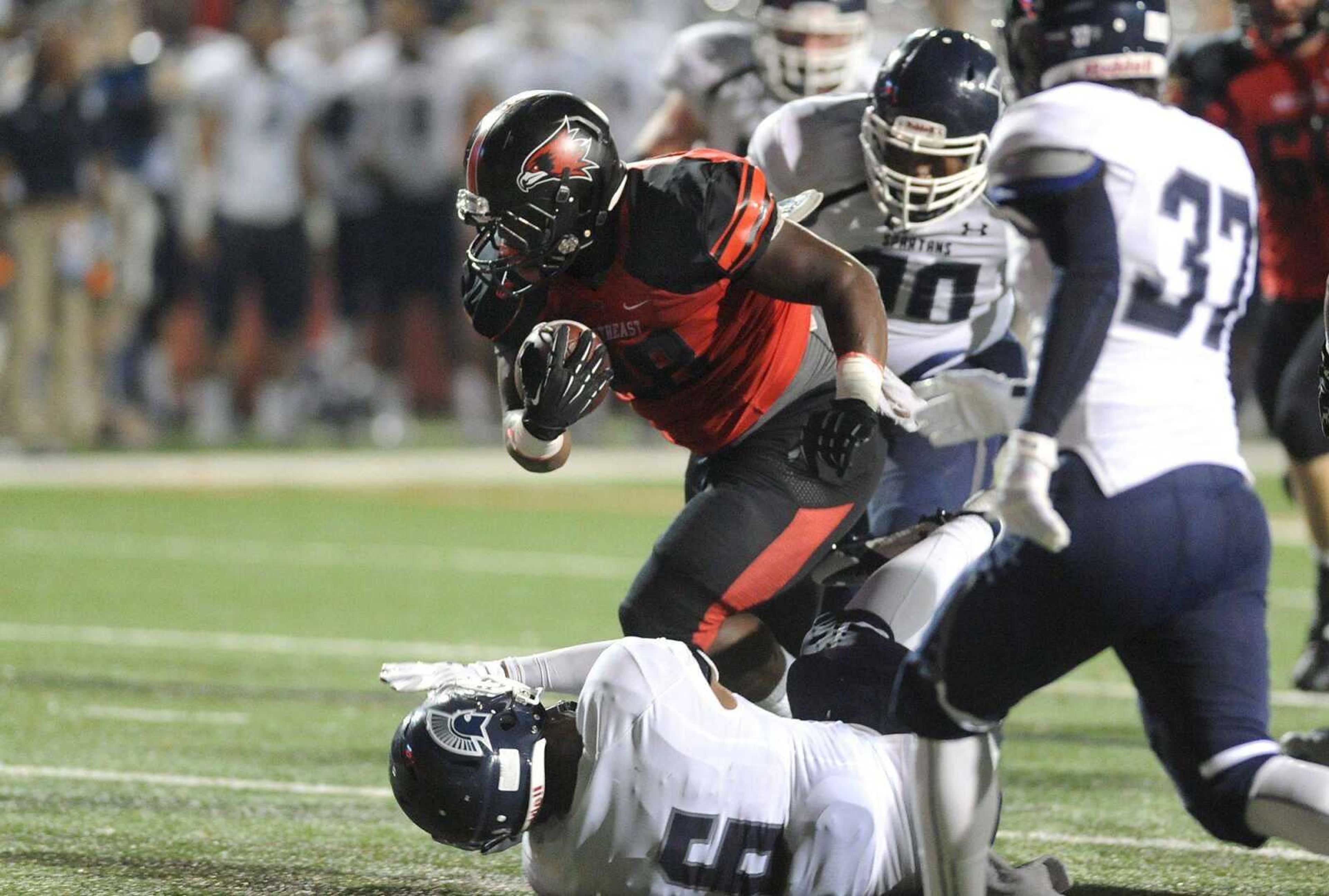 Southeast Missouri State's Lewis Washington breaks through Missouri Baptist's defensive line to score a touchdown in the third quarter during the seasons first game Thursday, Aug. 28, 2014 at Houck Stadium. (GLENN LANDBERG)