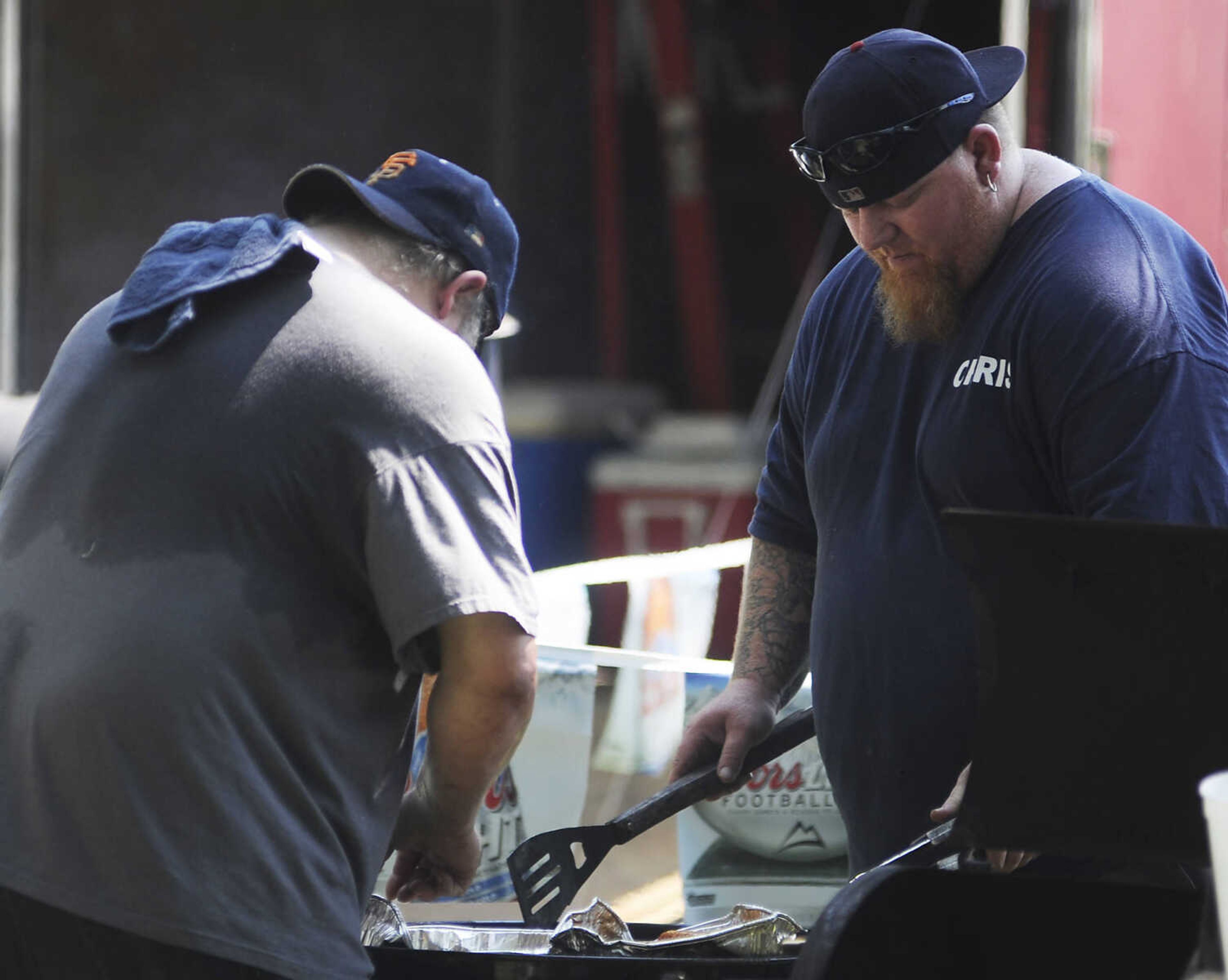 The Pit Squad, Royce Crawford Sr., left, and Chris Redding during the 21st annual Cape BBQ Fest Saturday, Aug. 24, at Arena Park in Cape Girardeau.