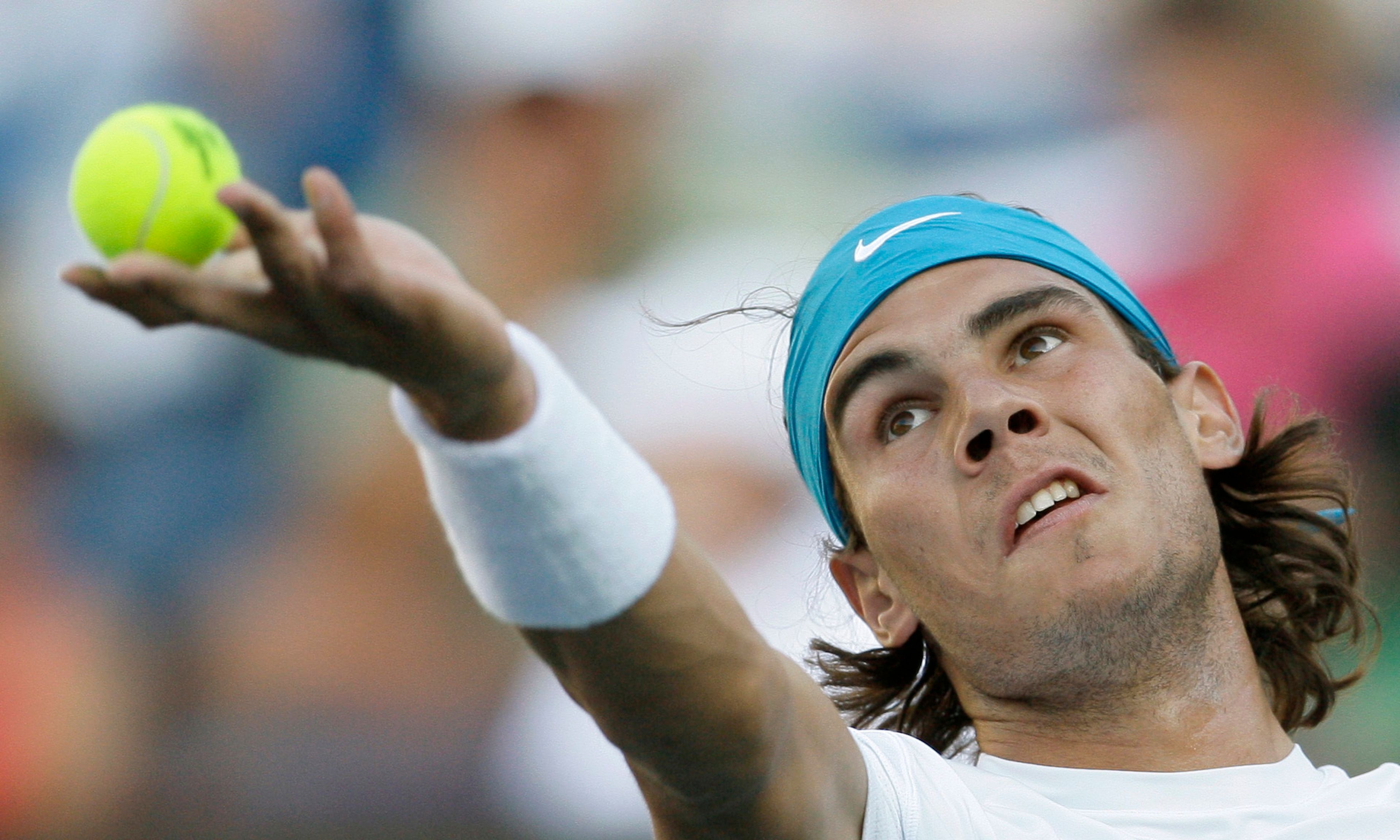 FILE - Rafael Nadal, of Spain, serves to Dmitry Tursunov, of Russia, during a match at the BNP Paribas Open tennis tournament Tuesday, March 17, 2009, in Indian Wells, Calif., as he has announced he will retire from tennis at age 38 following the Davis Cup finals in November. ( (AP Photo/Matt Slocum, File)