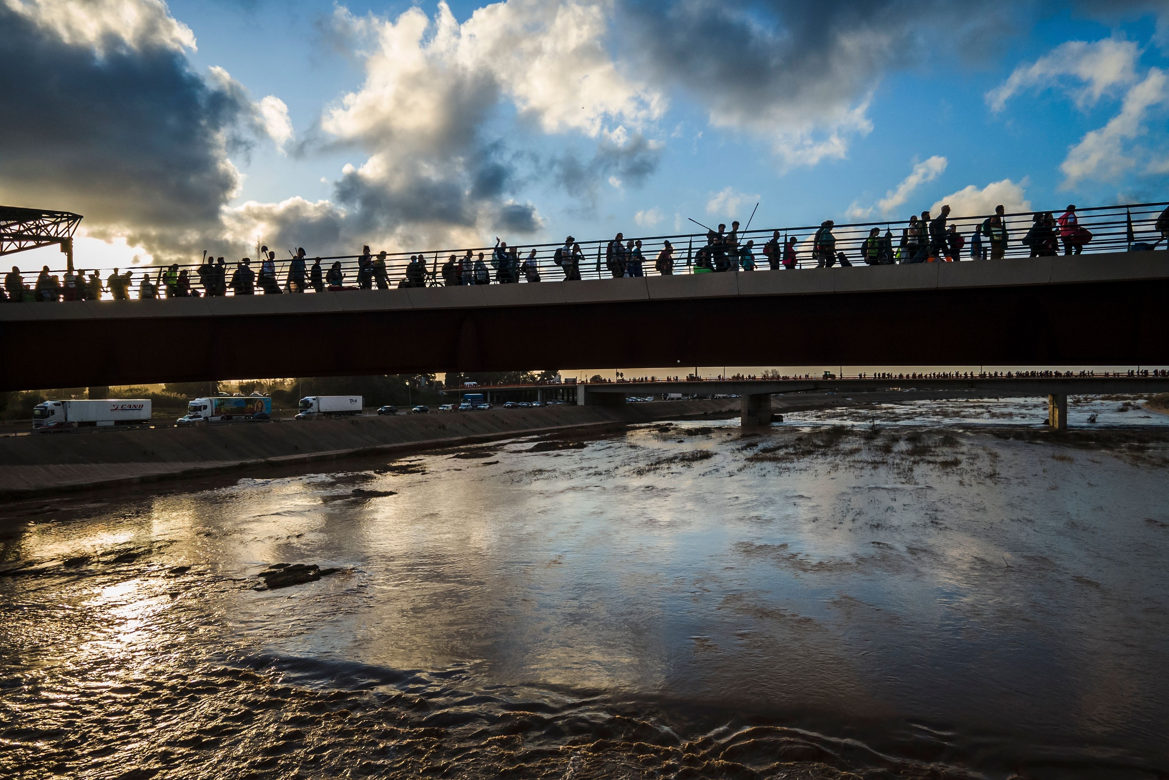 Volunteers return from helping affected municipalities four days after flash floods swept away everything in their path in the town of Paiporta, the epicentre of the storm, outskirts of Valencia, Spain, Saturday, Nov. 2, 2024.(AP Photo/Angel Garcia)