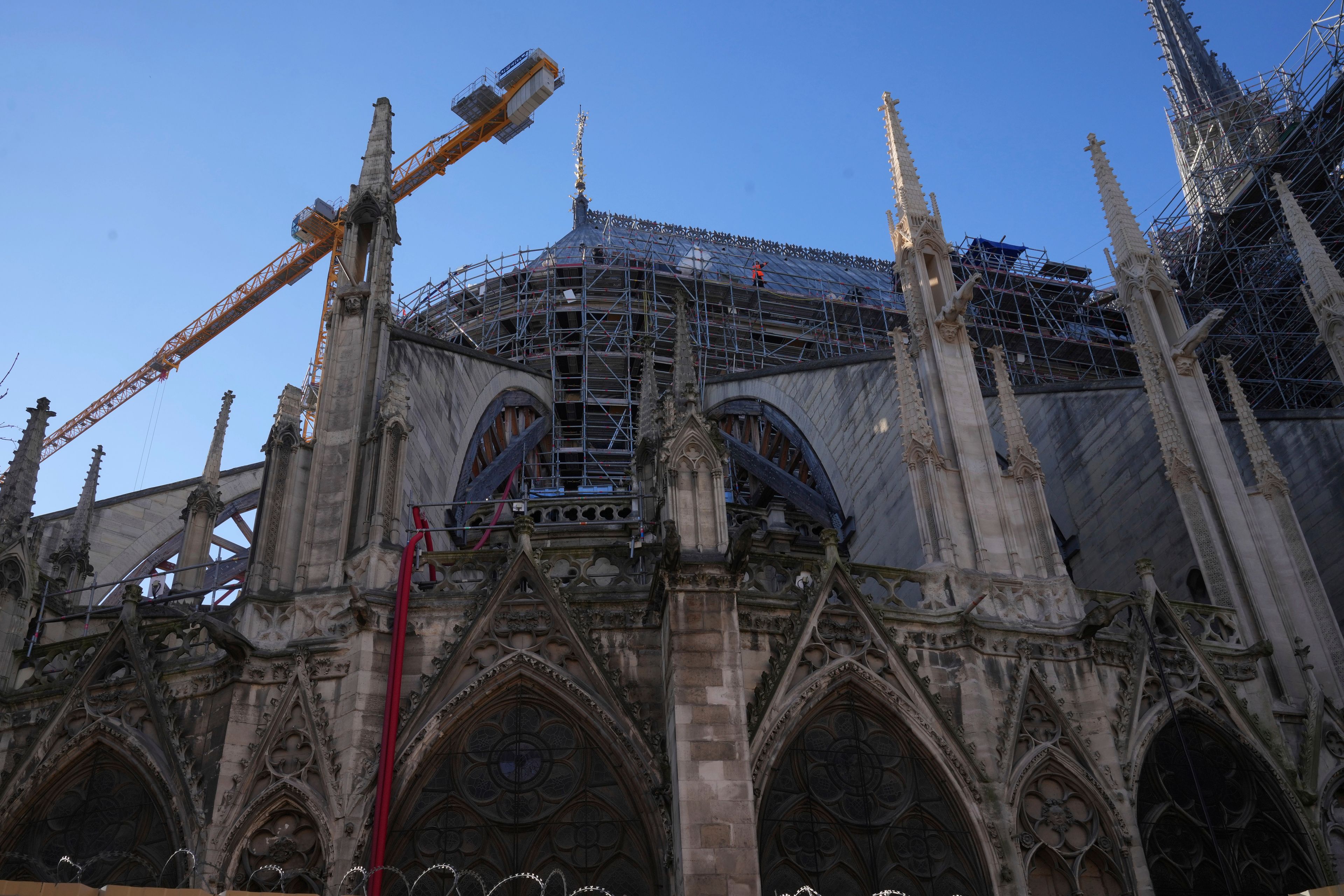 A workers walks on scaffolding at Notre-Dame cathedral, Thursday, Nov. 28, 2024 in Paris. (AP Photo/Michel Euler)