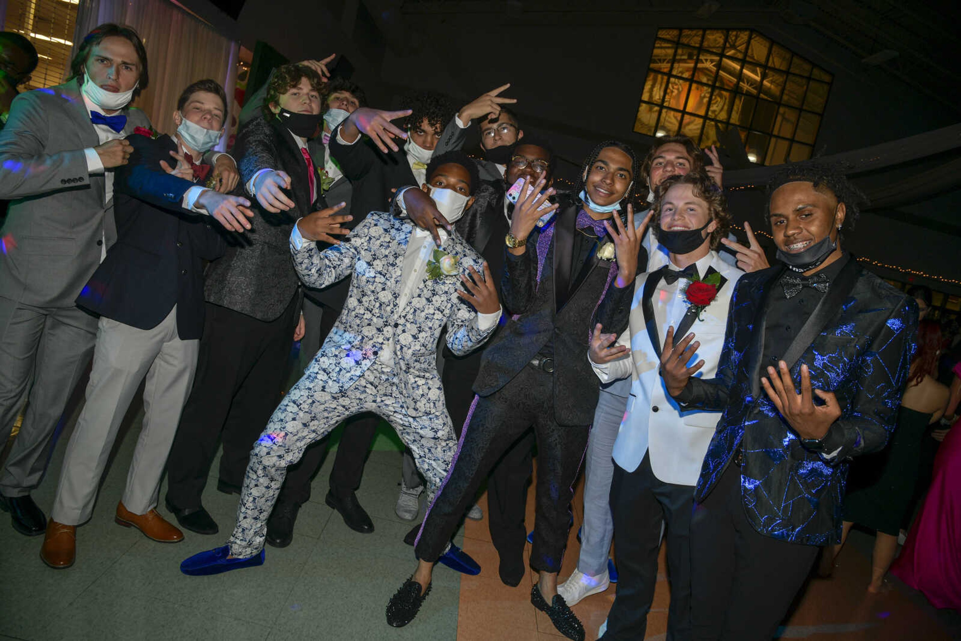 Students pose for a photo on the dance floor during the prom at Cape Central High School in Cape Girardeau on Saturday, May 8, 2021.