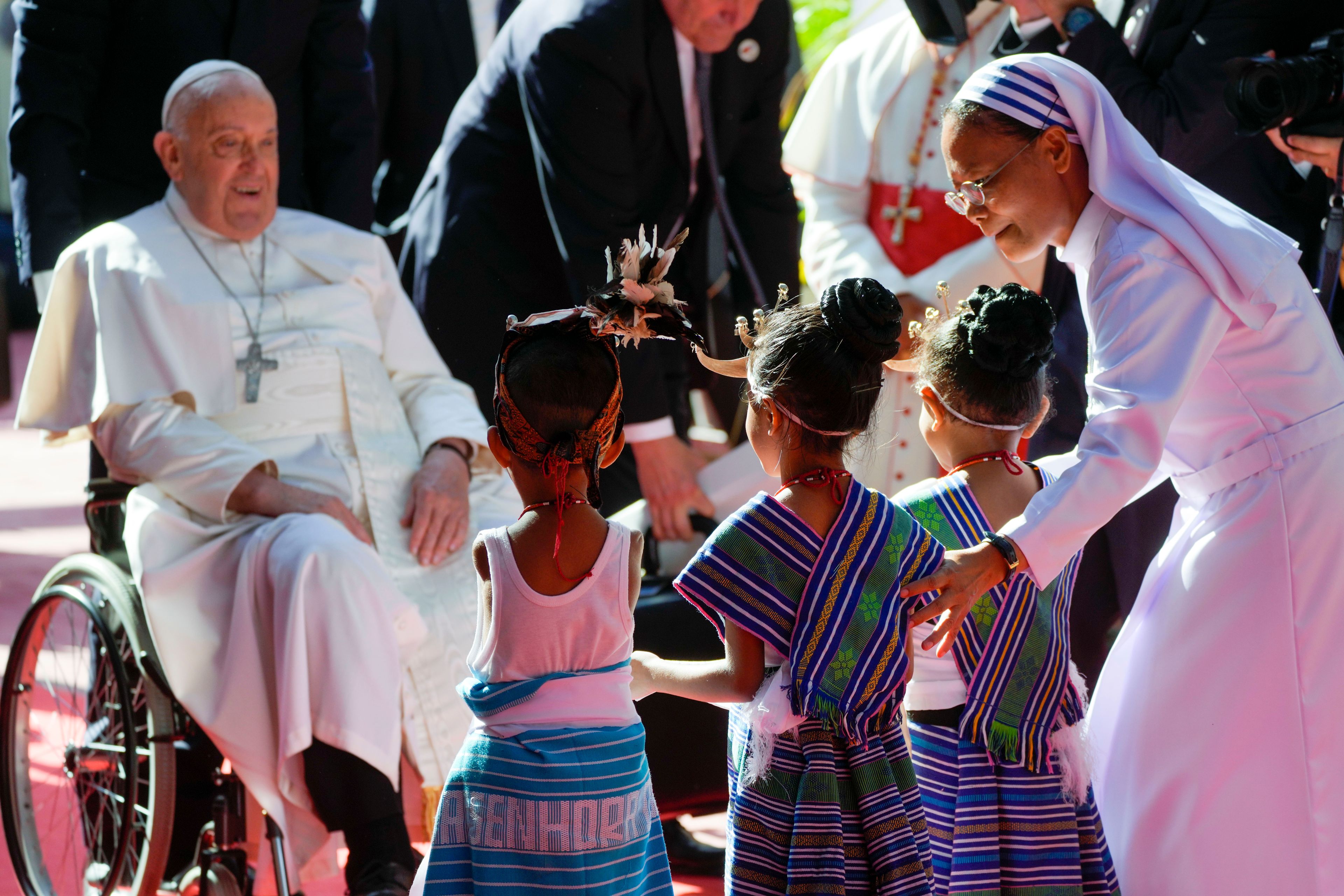 Pope Francis arrives at the 'Irmas ALMA' (Sisters of the Association of Lay Missionaries) School for Children with Disabilities in Dili, East Timor, Tuesday, Sept. 10, 2024. Pope Francis has indirectly acknowledged the abuse scandal in East Timor involving its Nobel Peace Prize-winning independence hero Bishop Carlos Filipe Ximenes Belo. "Let us also not forget that these children and adolescents have their dignity violated," Francis said. "In response, we are all called to do everything possible to prevent every kind of abuse and guarantee a healthy and peaceful childhood for all young people." (AP Photo/Gregorio Borgia)