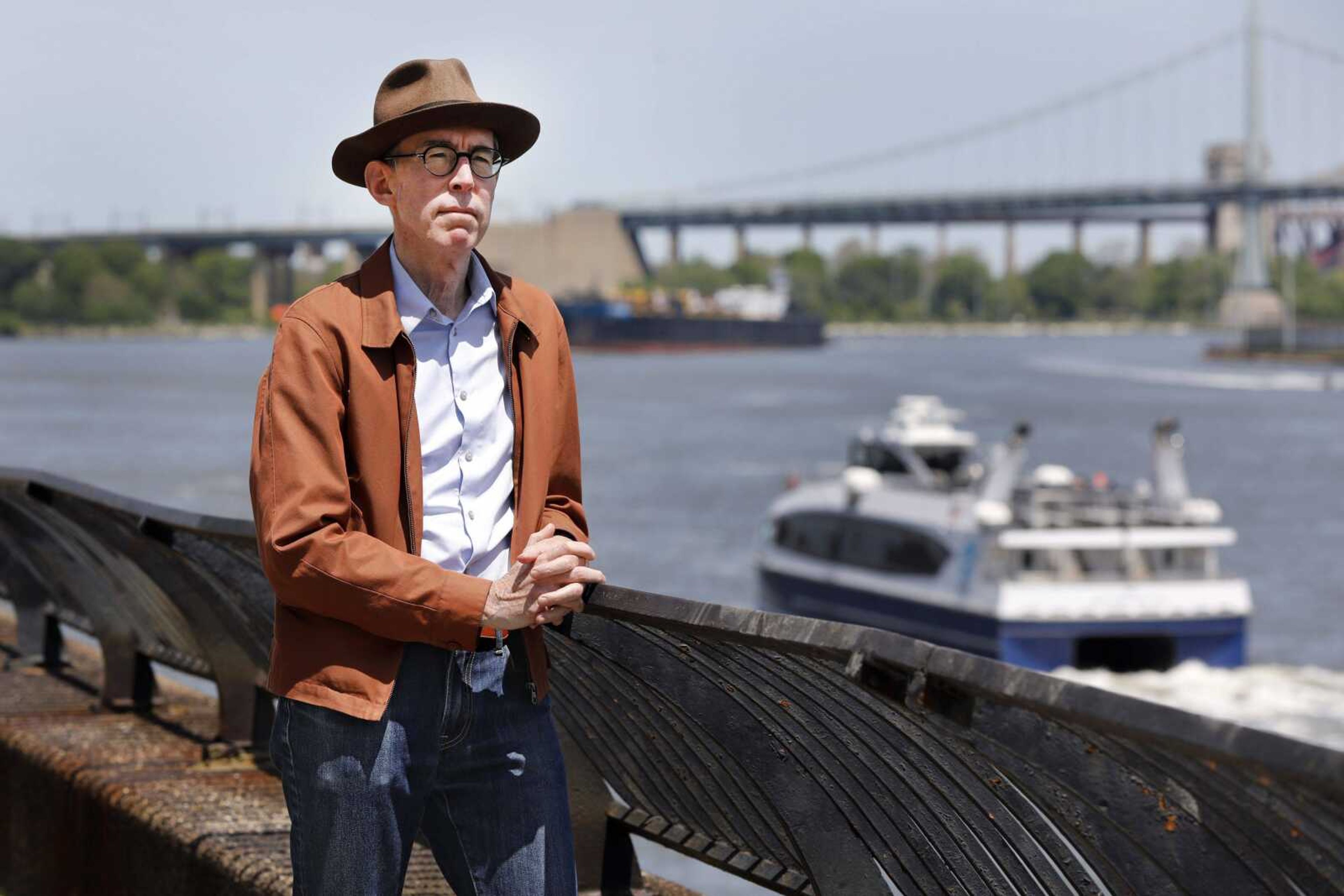 Kevin Kusinitz, a 63-year-old New Yorker who spent years being rejected from jobs for which he felt overqualified following an August 2012 layoff, poses for a photo Wednesday on New York's East River.