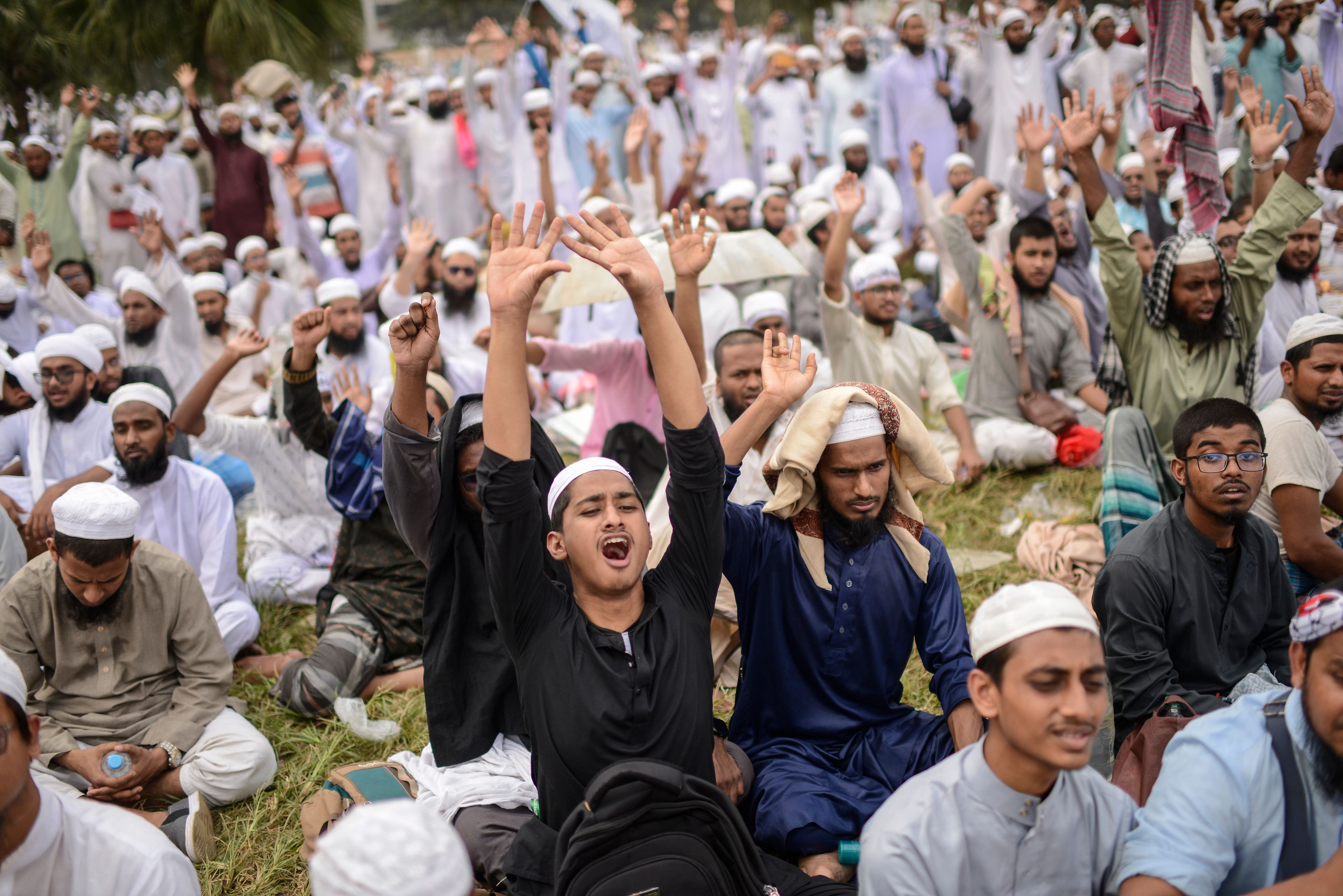 Thousands of Tabliq Jamaat members shout slogans during a rally to show their strength and demand that Islamic education is introduced in all stages along with other demands, in Dhaka, Bangladesh, Tuesday, Nov. 5, 2024 . (AP Photo/Mahmud Hossain Opu)